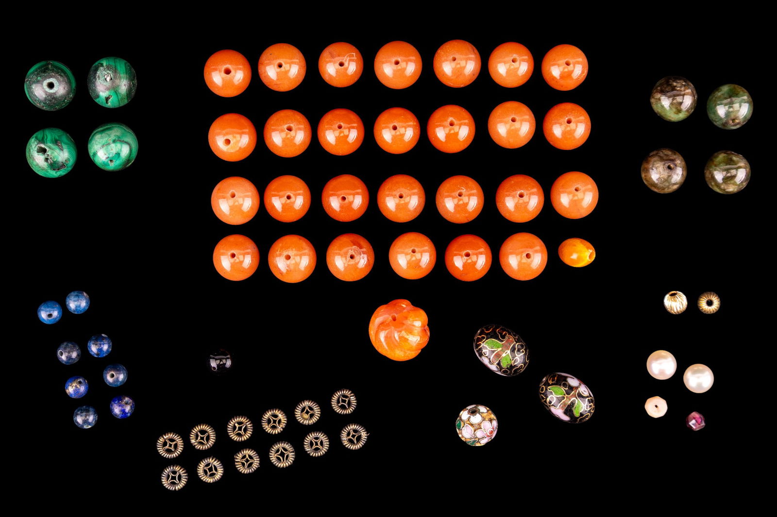 Loose Natural Stone Craft Jewelry Beads: Small assortment of loose craft jewelry beads featuring polished spherical and carved carnelian, malachite, lapis lazuli, brass and enamel cloisonne, and others.
