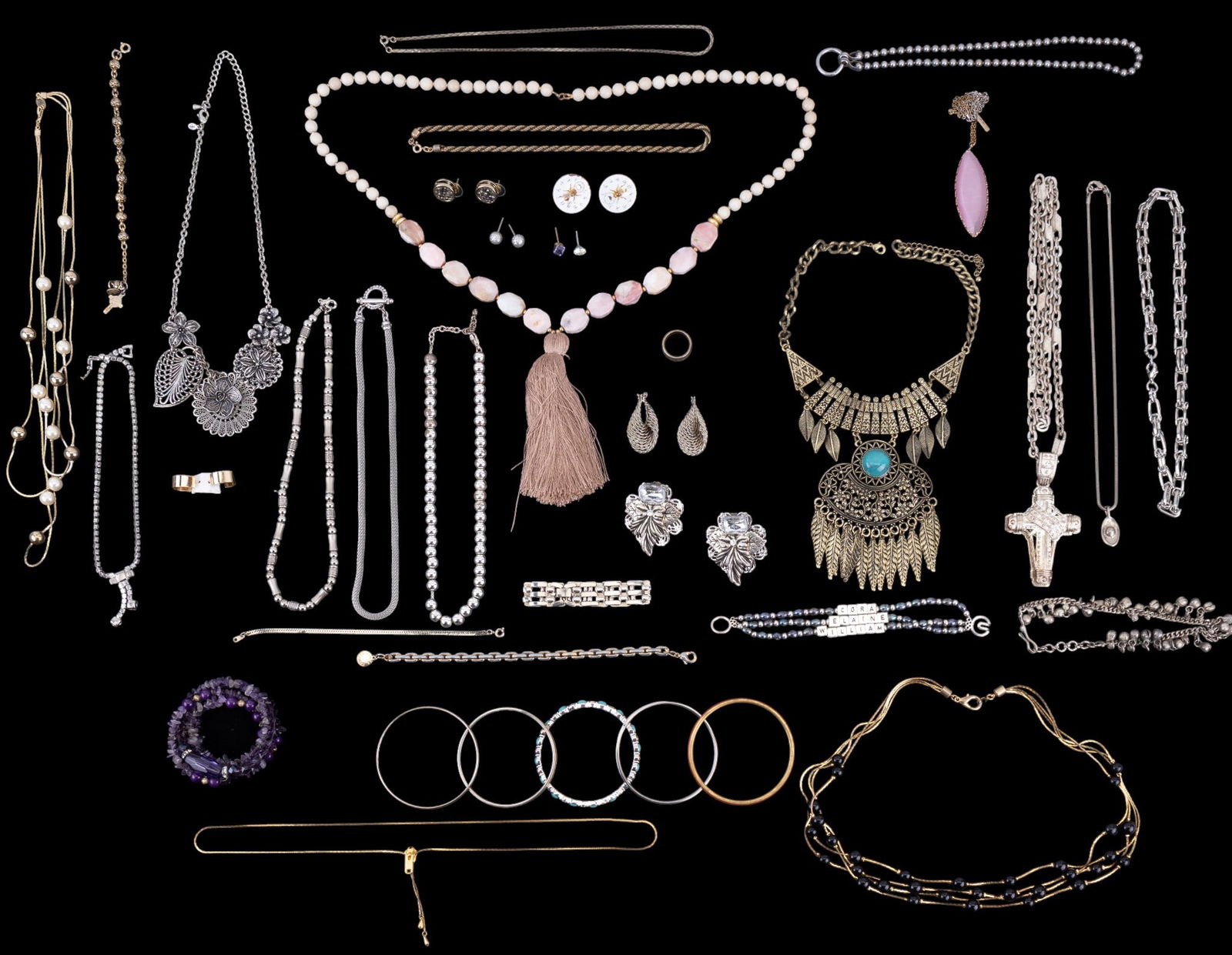 Silver Tone and Other Costume Jewelry: Grouping of costume jewelry including statement necklaces, Lane Bryant Pink glass necklace, Monet cuff bracelets, CLK zipper necklace, Vince Camuto bracelet, bug lock screwback, large silver tone neck