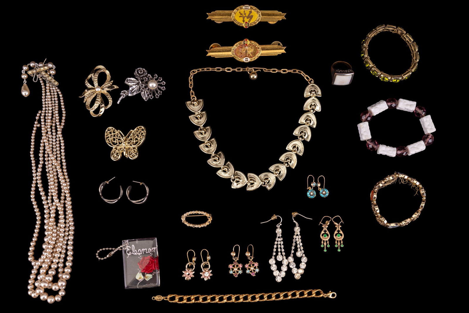 Estate Jewelry: Selection of pearl and gold tone vintage necklaces, several bracelets, and pairs of earrings.