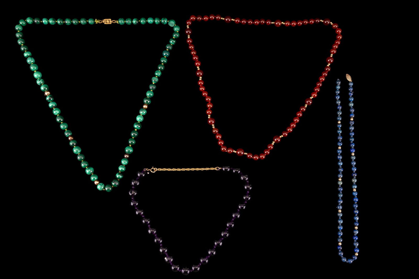Semi Precious Necklaces: Carnelian, amethyst, malachite, and lapis semi precious necklaces; some with 14K bead spacer.
