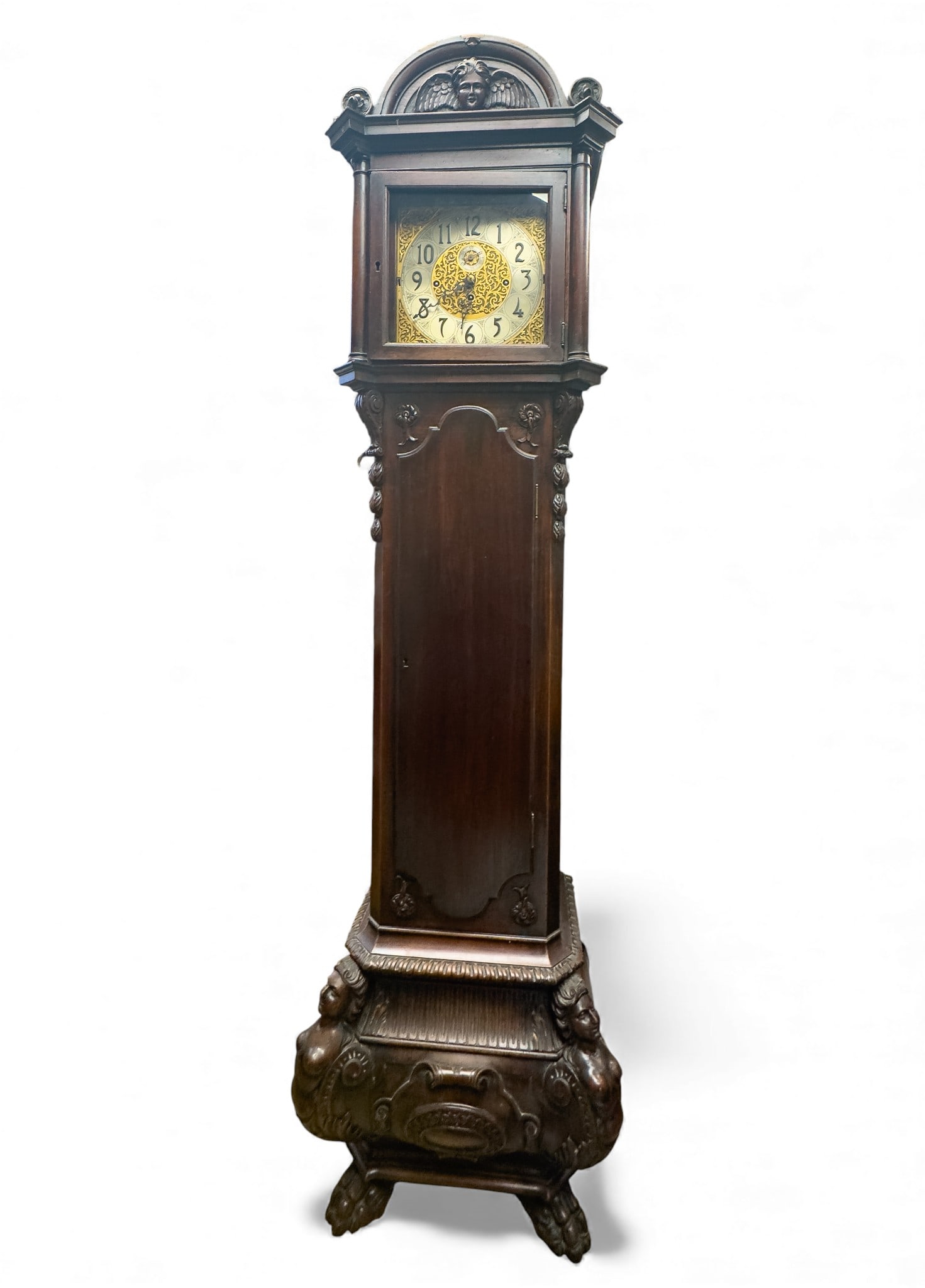 Herschede English Case Antique Grandfather Clock: An antique Hershede tall case clock in antique hand carved Richard Cleaver & Sons English walnut case measuring approx. 90" high x 20 " wide x 16" deep. Case is intricately carved with cherub on top a