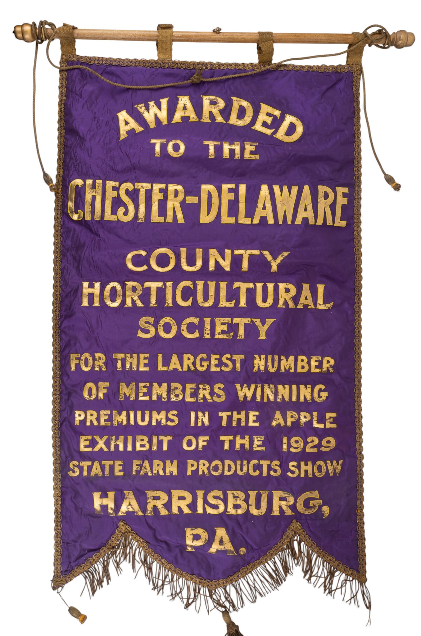 19th C PA Farm Show Silk Banner: A 19th C purple silk Pennsylvania Farm Show banner with metal tassels, measures approx. 24" W x 44" H with a 31" W pole.