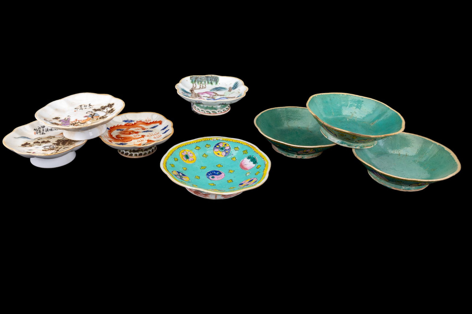 Chinese Tongzhi and Footed Porcelain Dishes: A collection of four turquoise ground Tongzhi bowls and four footed porcelain dishes featuring designs such as iron red dragons and bats, monochrome landscape scenery, and more. Largest approx 7" diam