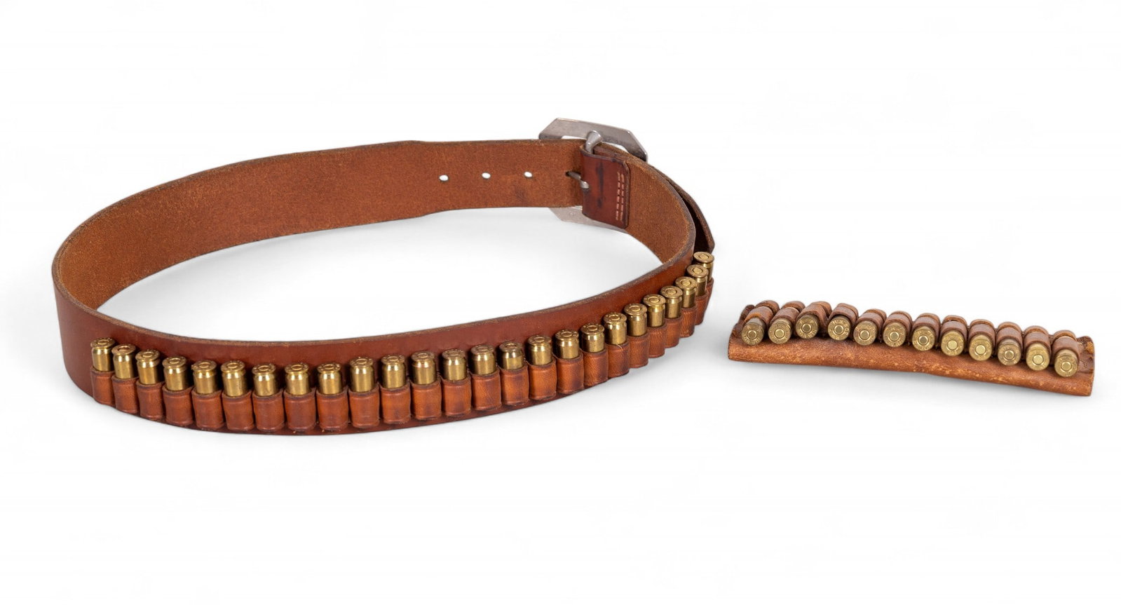 Vintage Leather Ammunition Holders: Grouping includes 2 vintage leather ammunition acessories, one full length cartridge belt and one smaller detachable ammo sleeve, both filled with assorted rounds.
