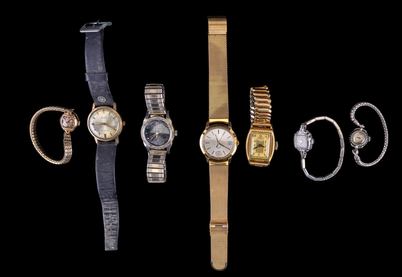 Elgin, Bulova, Gruen, & Other Early Wrist Watches: Vintage New Haven gold tone wrist watch on Zafran #116 stretch band, a silver tone Westclox #Model 745 one jewel ladies wrist watch, a Jostens General Electric commemorative wrist watch on a 10K GF me