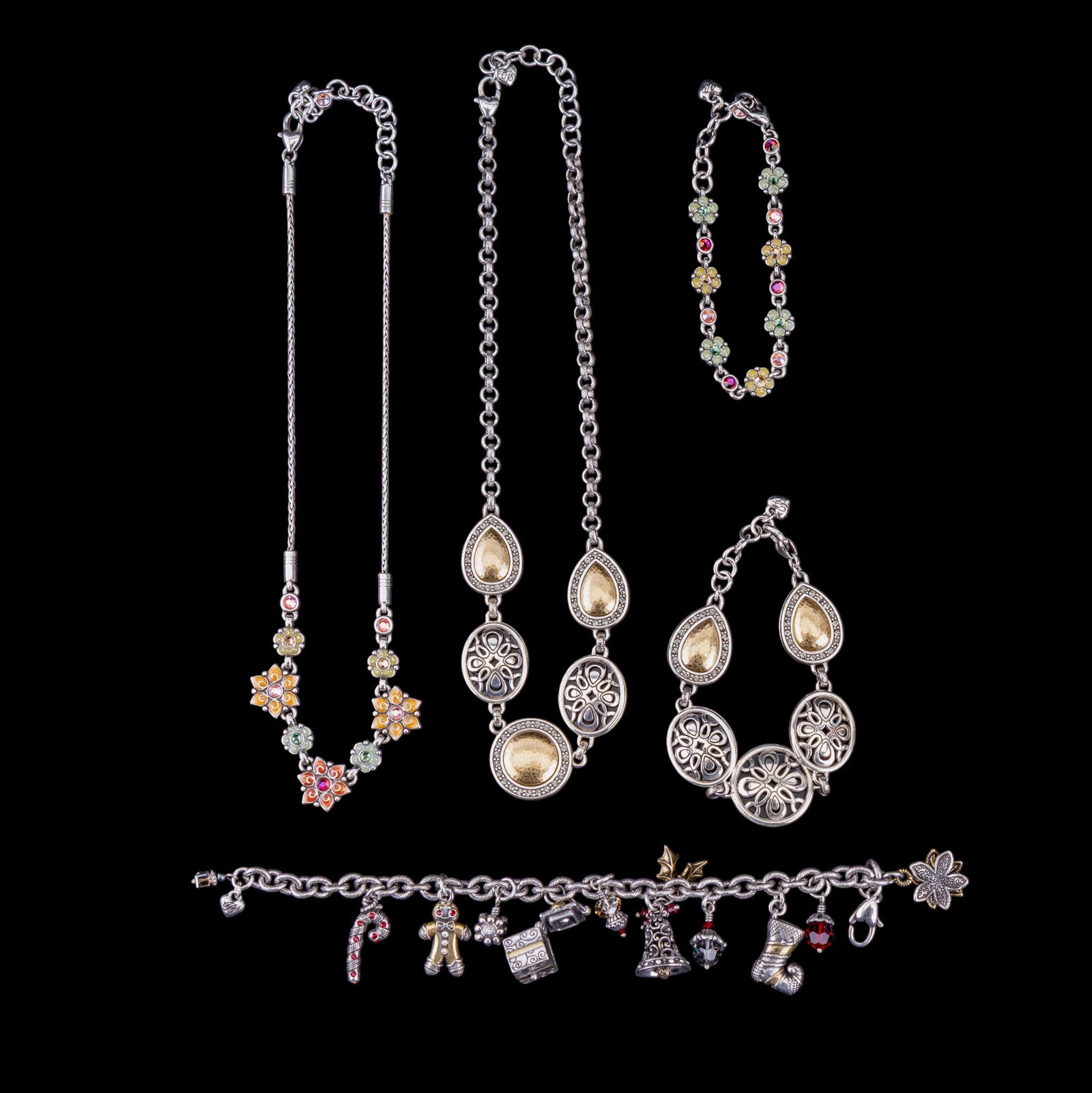 Brighton Jewelry Sets: A collection of two Brighton brand jewelry sets featuring filigree and gold tone set, an enamel and rhinestone floral set, and a Christmas themed charm bracelet.
