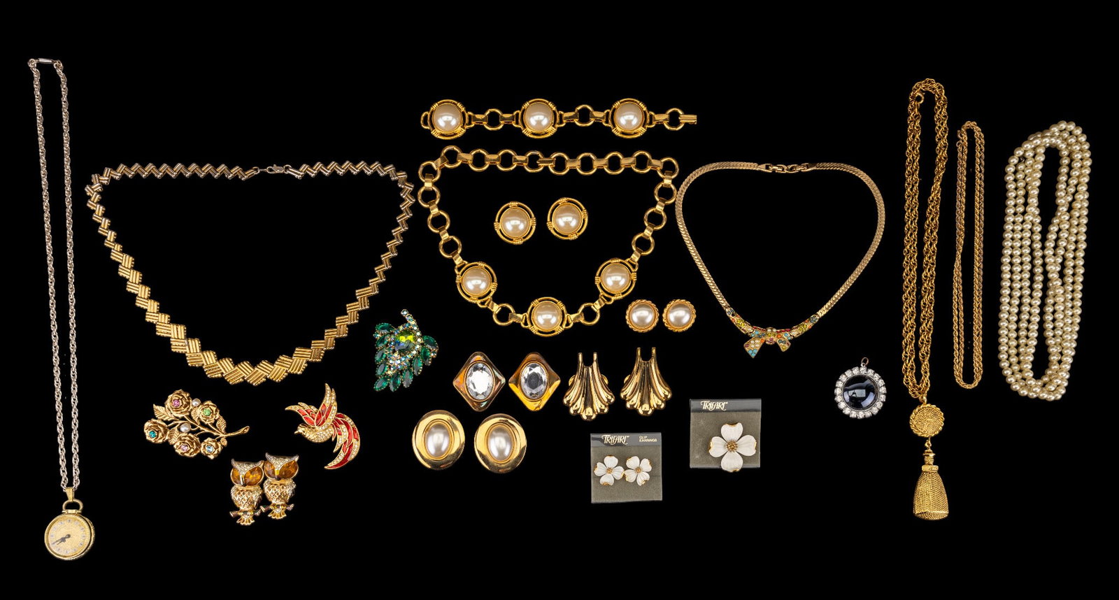Costume Jewelry with Trifari and Giorgio: Costume jewelry, including a Giorgio bird brooch, matching necklace, bracelet, and earrings. Includes an owl duo fur clip and a Trifari floral brooch with matching earrings, both still on original car