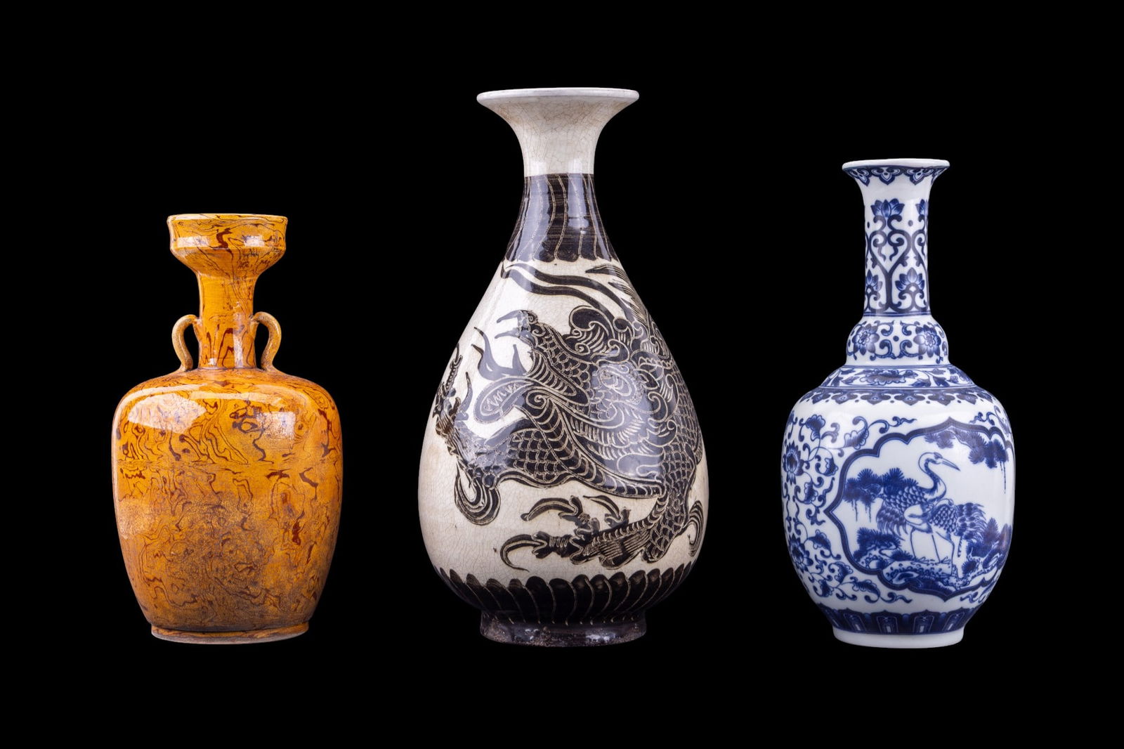 Chinese Porcelain Vases: Collection of three Chinese porcelain vases featuring a Cizhou kiln style yuhuchun vase (approx. 12.5" H), a blue and white porcelain vase featuring a bird and floral motif with a six character Qianlo