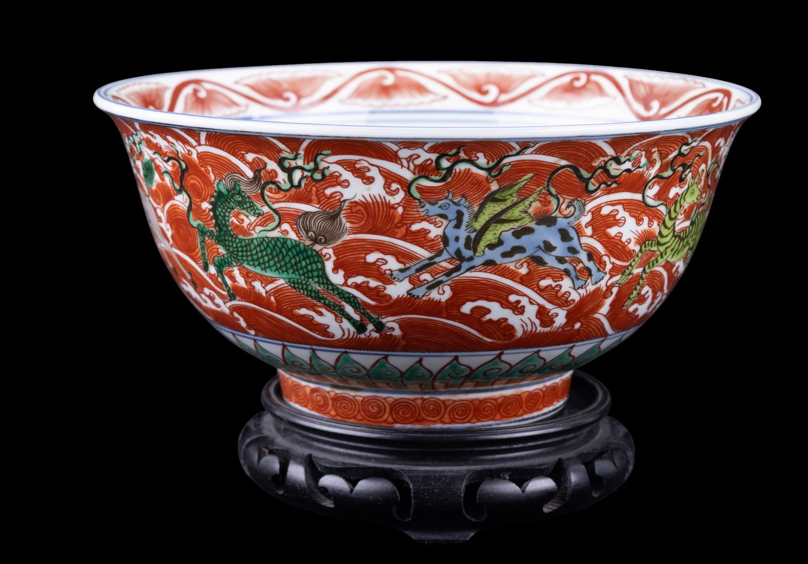 Chinese Porcelain Handpainted Animal Bowl: A Chinese porcelain bowl with handpainted images of elephants, zebra, dragon, winged fish, foo dog, horse & more. Six character chopmark housed in a double circle present on bottom. Bowl in very good 