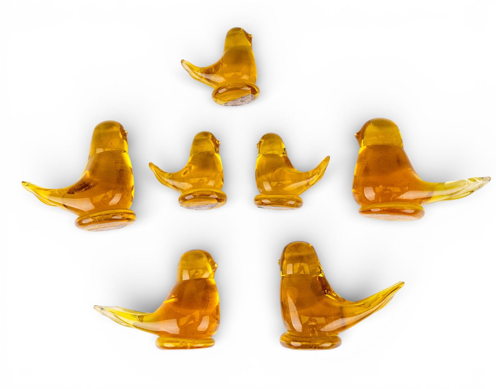 Golden Canary Art Glass Paperweight/Figurines: A collection of hand blown and signed Golden Canary art glass paperweights/figurines, including four 3" H and three 2" H.