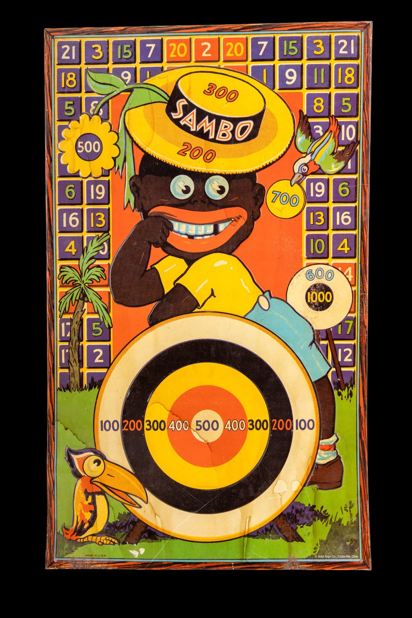 Black Americana Sambo Dart Board: Black Americana Sambo magnetic dart board. Measures approx. 20" x 12".