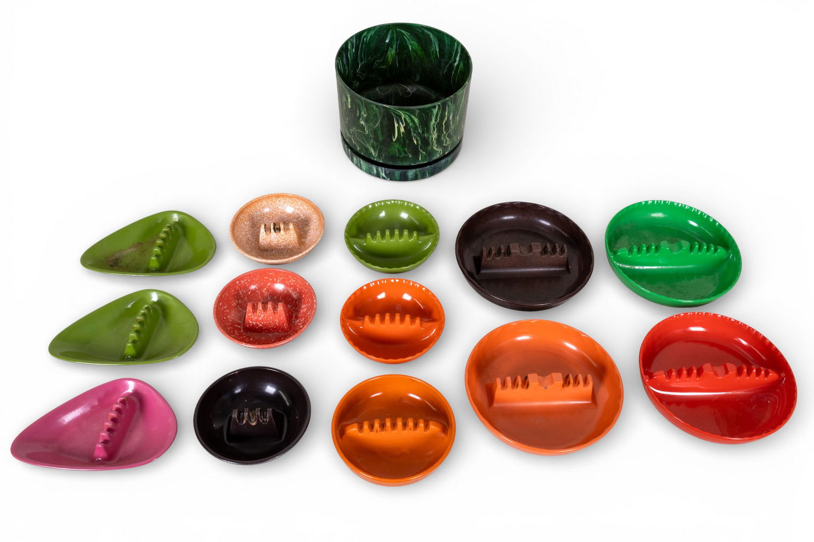 Mid Century Melamine Ashtrays and Planter: A collection of vintage mid century melamine ashtrays and green marbled plastic planter.