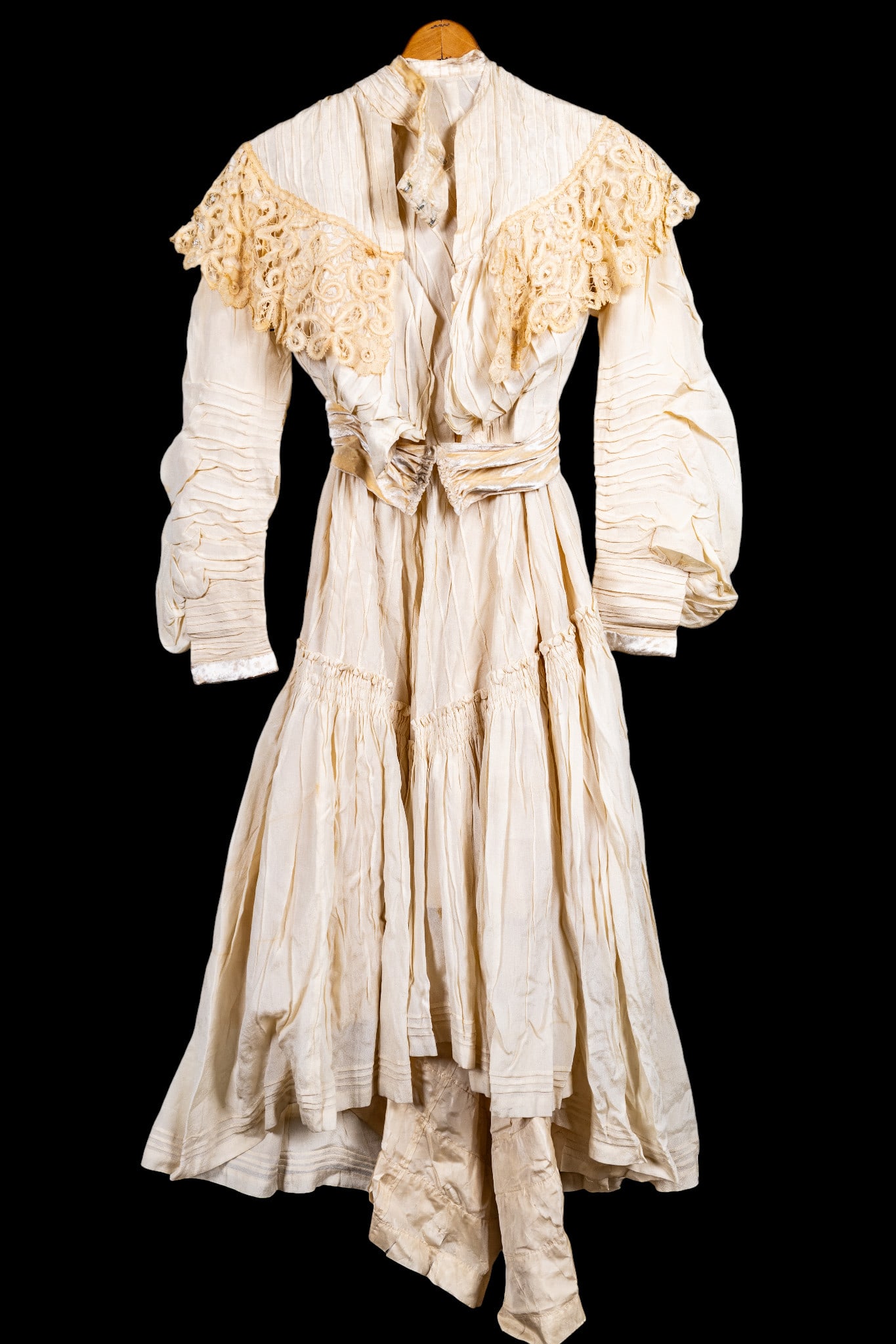 1903 Silk, Velvetted Wedding Gown w/ Lace: A 1903 silk wedding gown with genuine velvet trim and handmade lace worn by Carrie Bartleson. Gown has some staining and discoloration as seen in photography. Note: Heavy tears on inside silk.