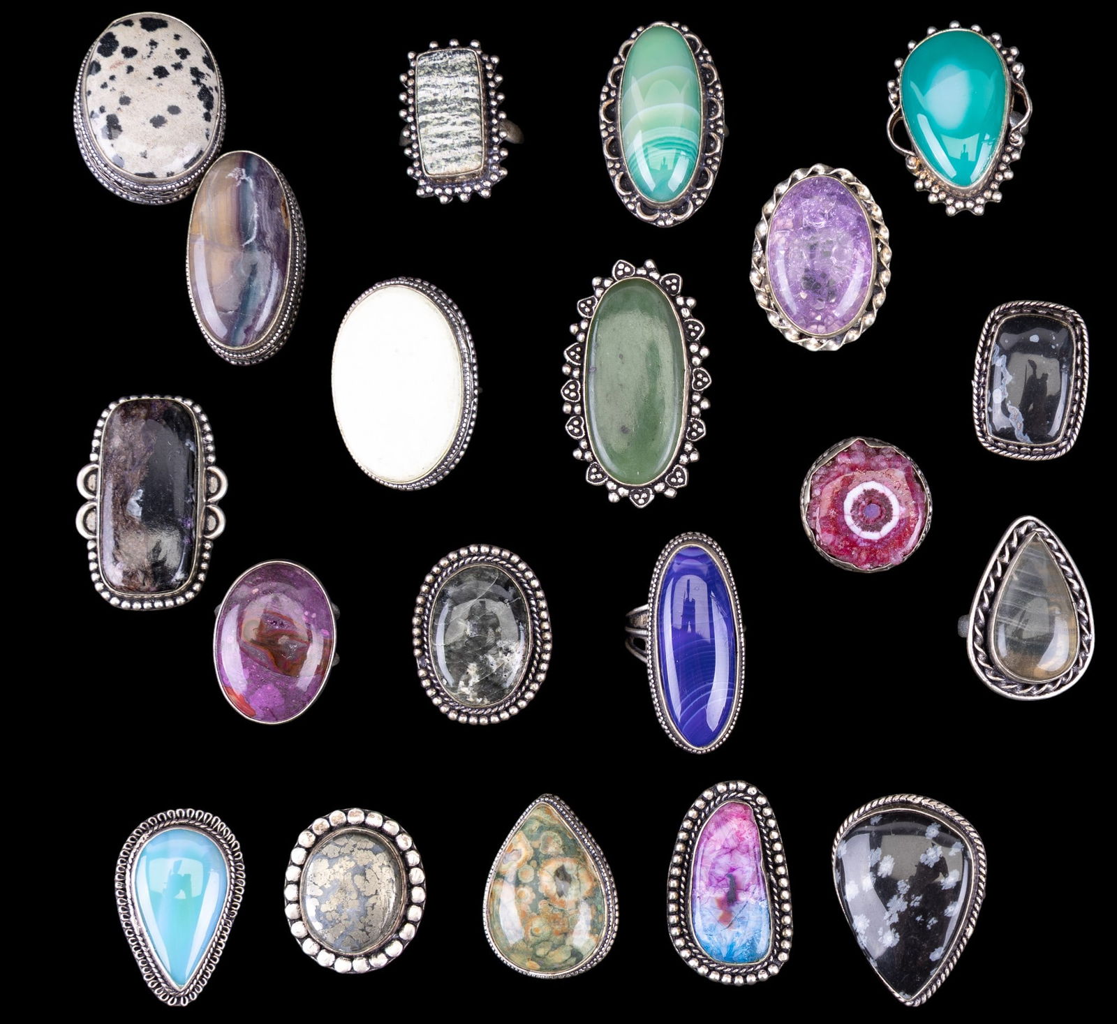 Hand Made Silver Plate & Semi Precious Stone Rings: A collection of 19 hand made silver plated rings featuring natural semi precious cabochon stones including Dalmation jasper, green aventurine, pink solar quartz, rainbow quartz, pyrite, and more. Size
