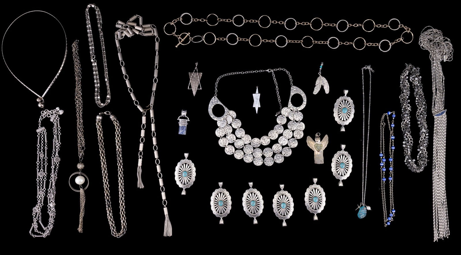 Vintage Silver Tone Jewelry: A collection of vintage silver tone jewelry featuring loose Native American style belt panels with howlite cabochons, a vintage collar necklace, a multistrand necklace with sodalite inlay, sea glass a