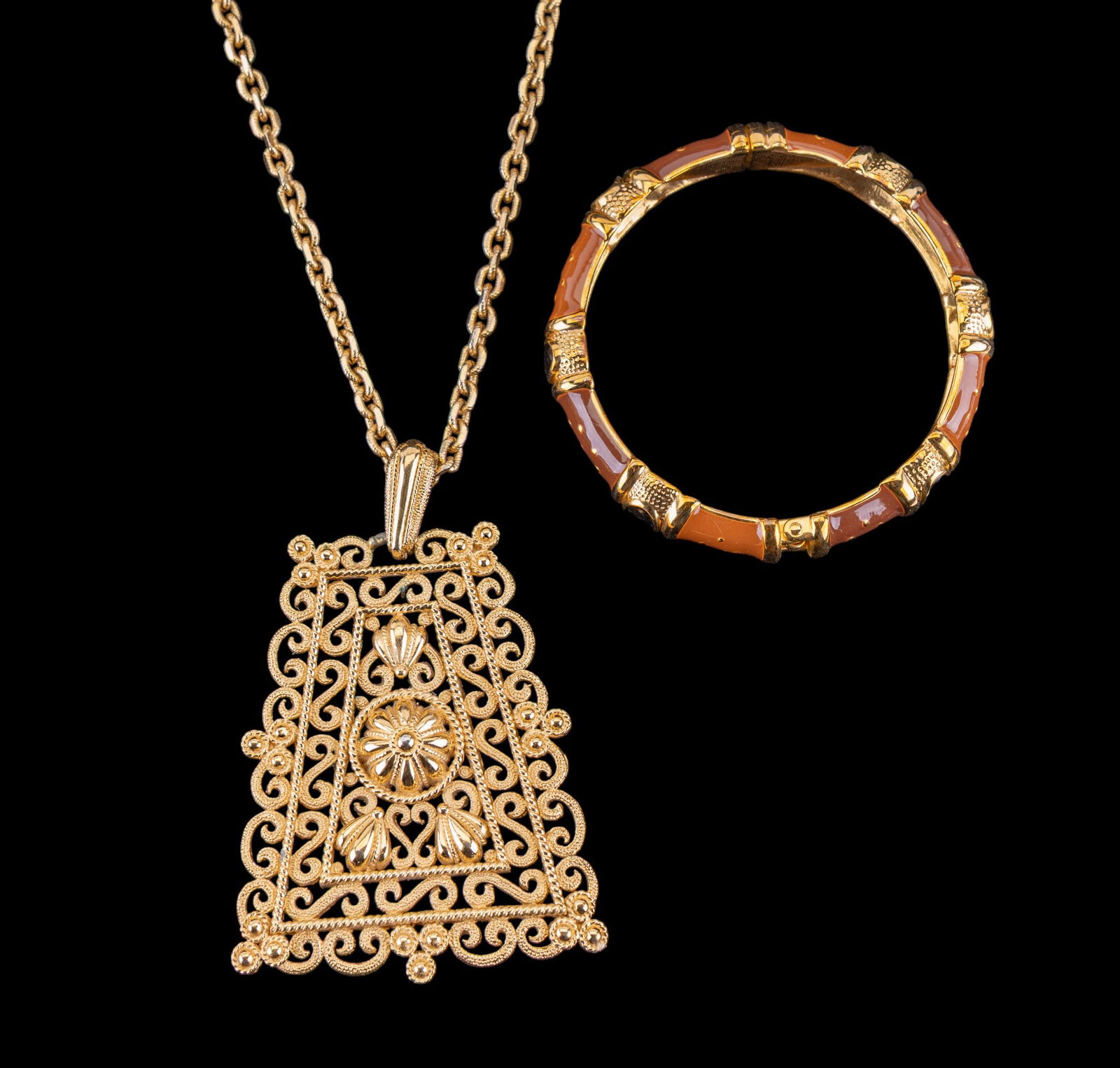 Joan Rivers + Trifari Jewelry: Joan Rivers enamel gold tone bangle and a large 1970's Trifari gold tone panel necklace.