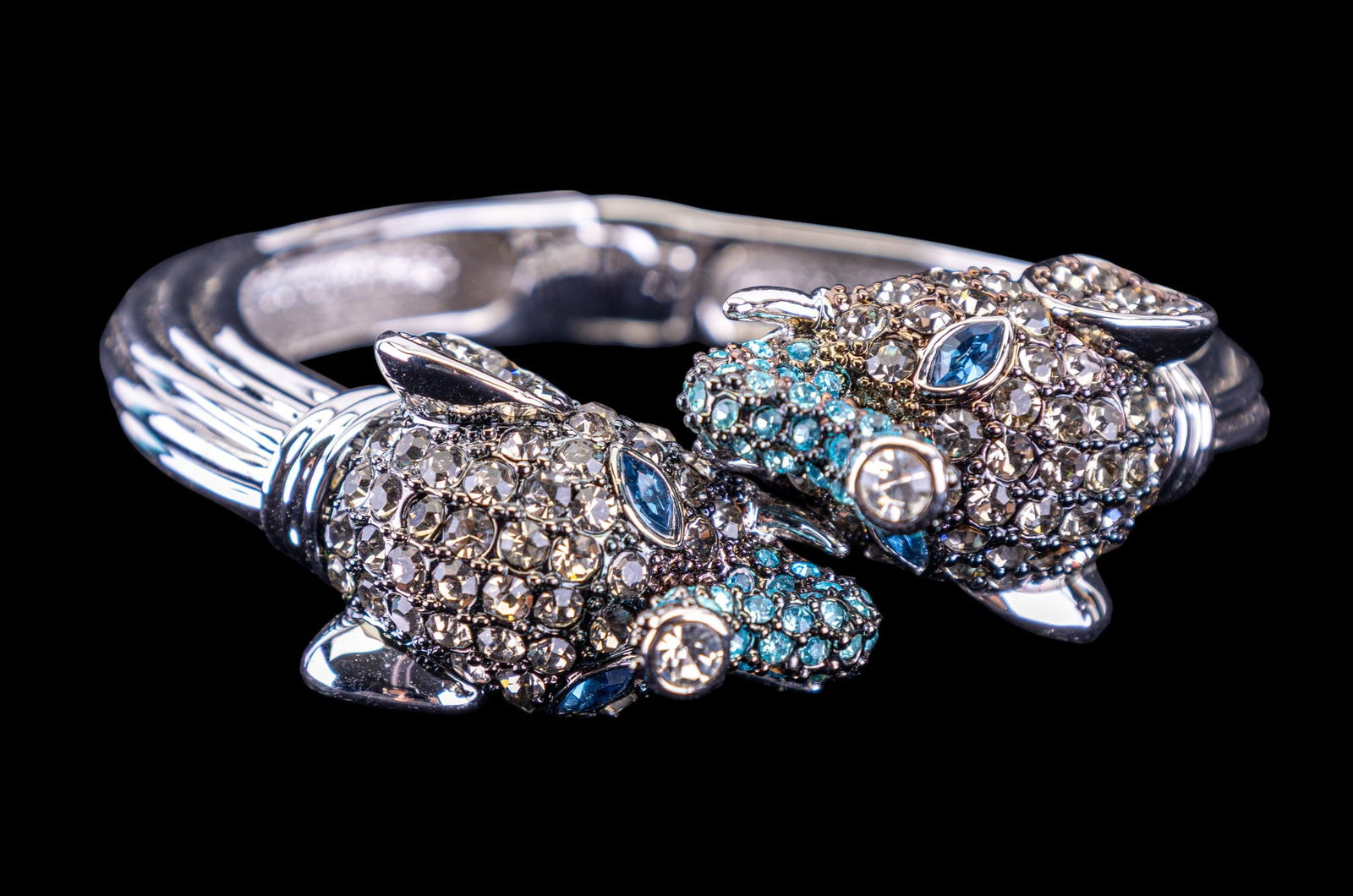 Large Crystal Elephant Bracelet: Silver tone elephant bracelet with double heads and colored crystal detail.