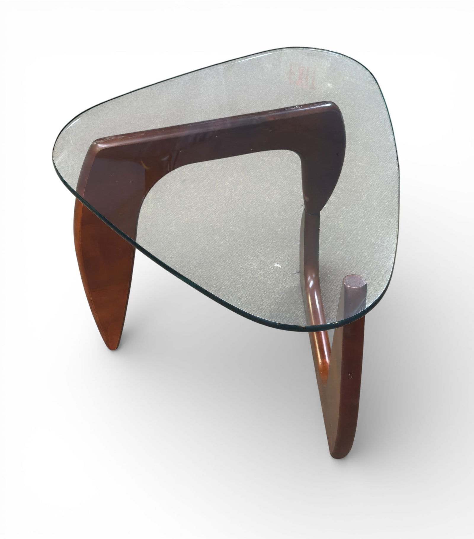 Isamu Noguchi Design MCM Coffee Table: A mid century modern glass top coffee table in Isamu Noguchi design. . Table measures approx. 19" high x 24" end to end at top. Condition is good, as seen in photography.