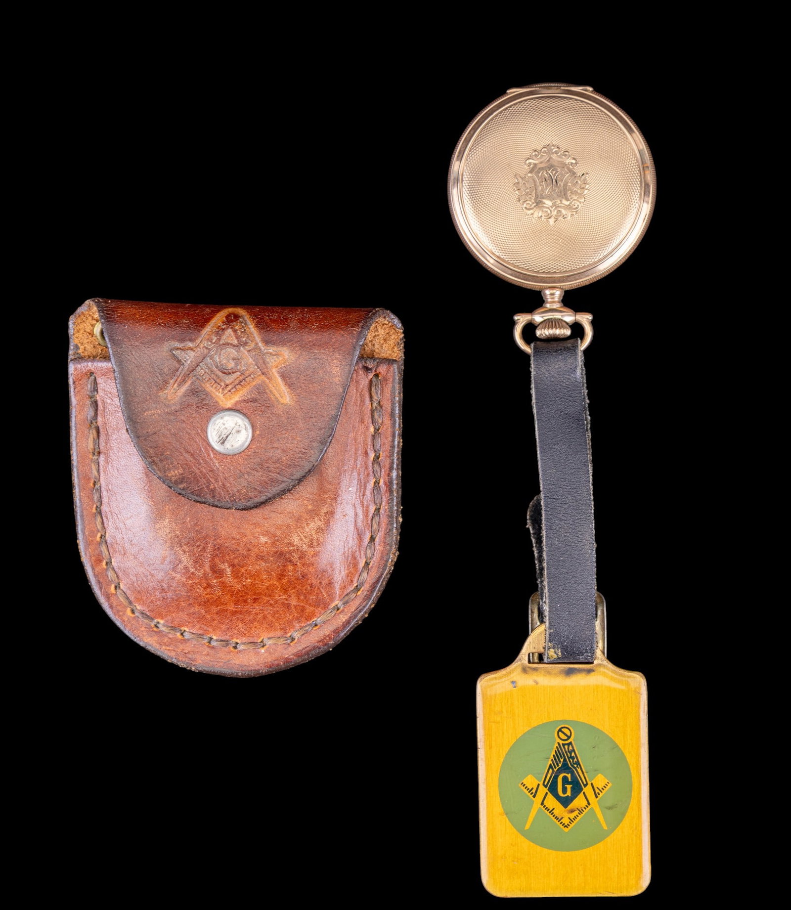 Elgin Masonic Pocket Watch w/ Leather Case: Elgin National Watch Co. 15-Jewel pocket watch, serial no. 21661559, housed in a J. Boss, Keystone case. Dial features Masonic symbols in place of numerals. Lot also includes a Masonic leather snap ca