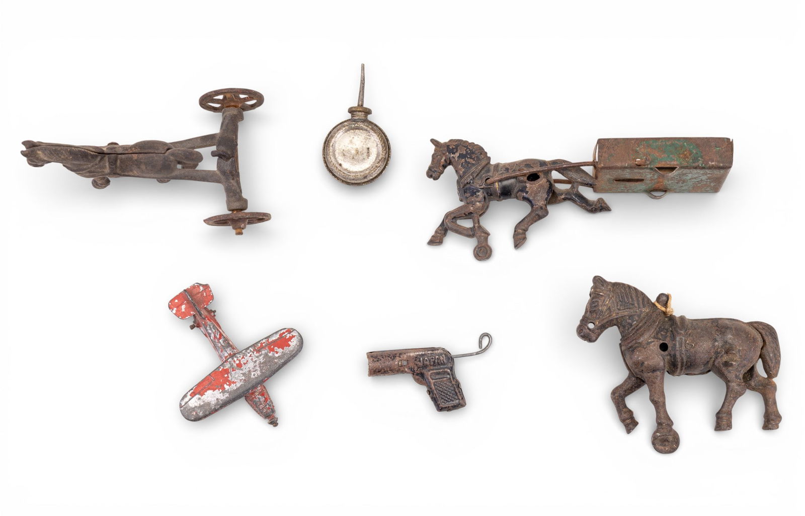 Cast Iron Horse Toys: A collection of cast iron horse toys/figurines, a miniature oil can, a vintage miniature metal toy plane, and an early miniature cap gun.