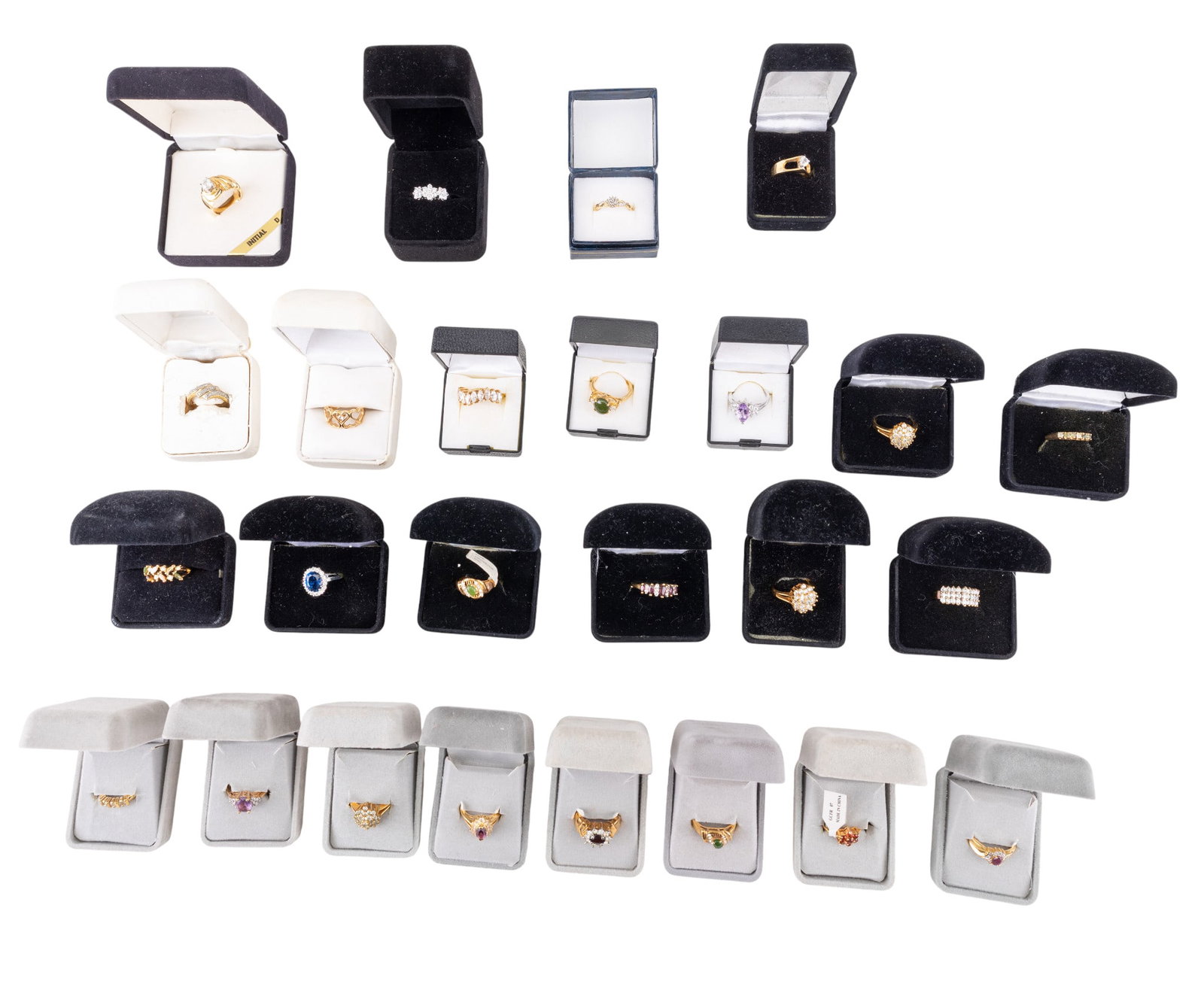 Gold and Silver Tone Costume Rings: A collection of 25 gold and silver tone costume rings each with accompanying ring boxes, featuring some semi precious stones, sizes range from 6 to 8.