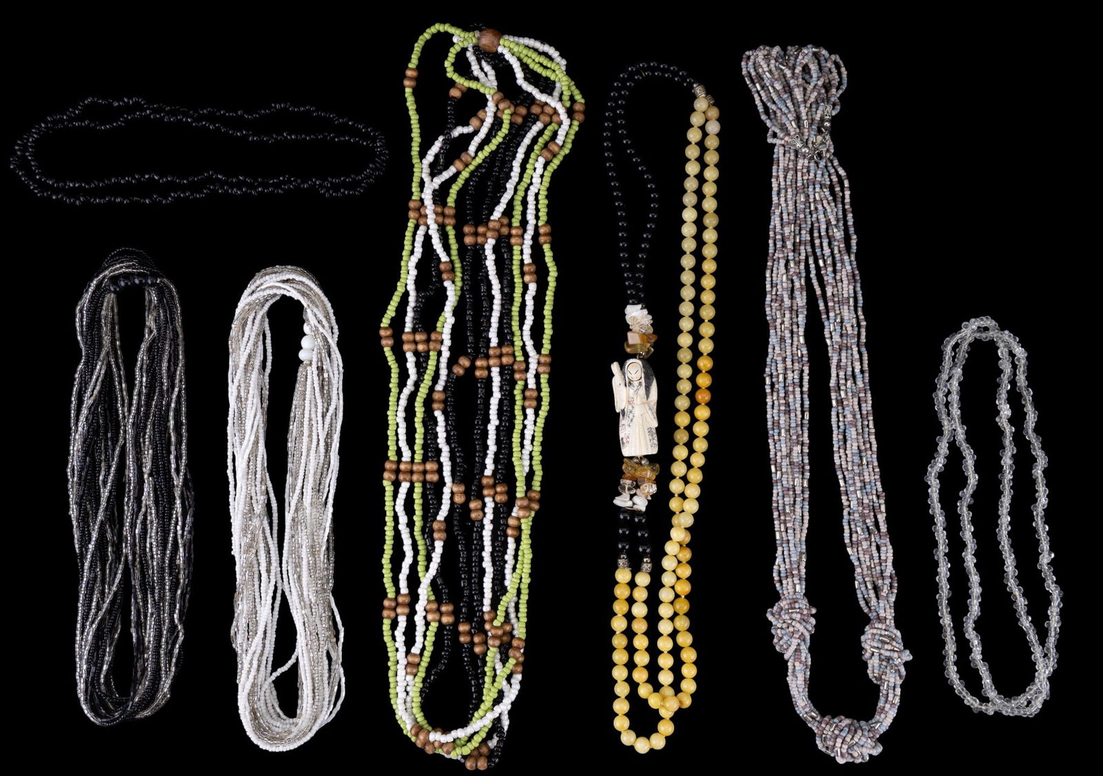Asian and Other Beaded Necklaces (7): Seven multi-strand beaded necklaces featuring various bead styles, colors, and materials, including glass and wood accents. One necklace includes an Asian-inspired component with a rotating mood face.