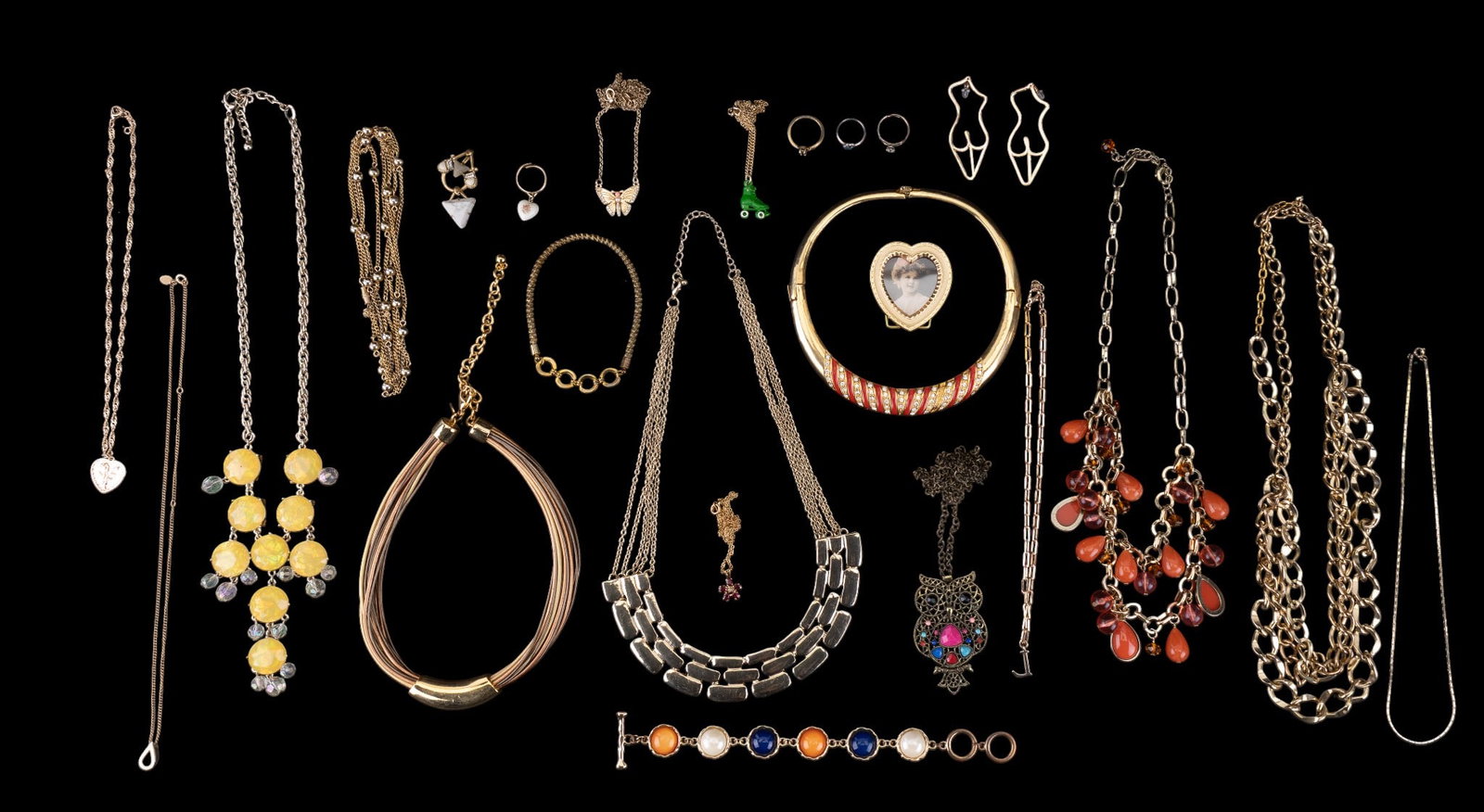 Gold Tone Statement & Costume Jewelry, Avon: Multiple gold tone statement necklaces, gold tone small picture frame, nude figural gold tone costume earrings, a gold tone multi-colored bead panel bracelet, Avon gold tone petite necklace with penda