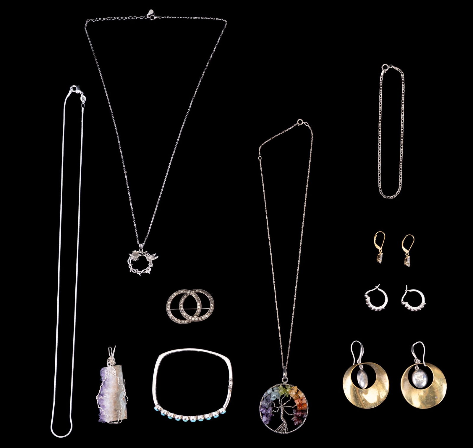 Sterling Silver Jewelry, Stone Pendants: Sterling silver jewelry consisting of necklaces, pendants, earrings signed ?RLM Studio,? a bangle bracelet, and a brooch. The two stone pendants feature a tree form design and a geode slice. Total app