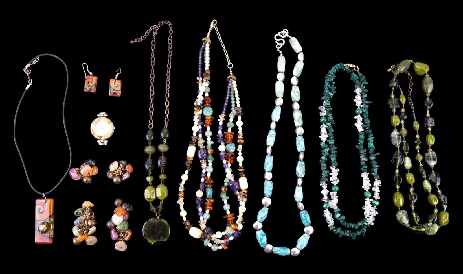 Stone. Art Glass Jewelry: Stone and art glass jewelry. Includes two pairs of polished stone earrings, five necklaces with polished stone, art glass, and silver-toned beads, one marked ?L.S.? on the clasp, a quartz watch with a