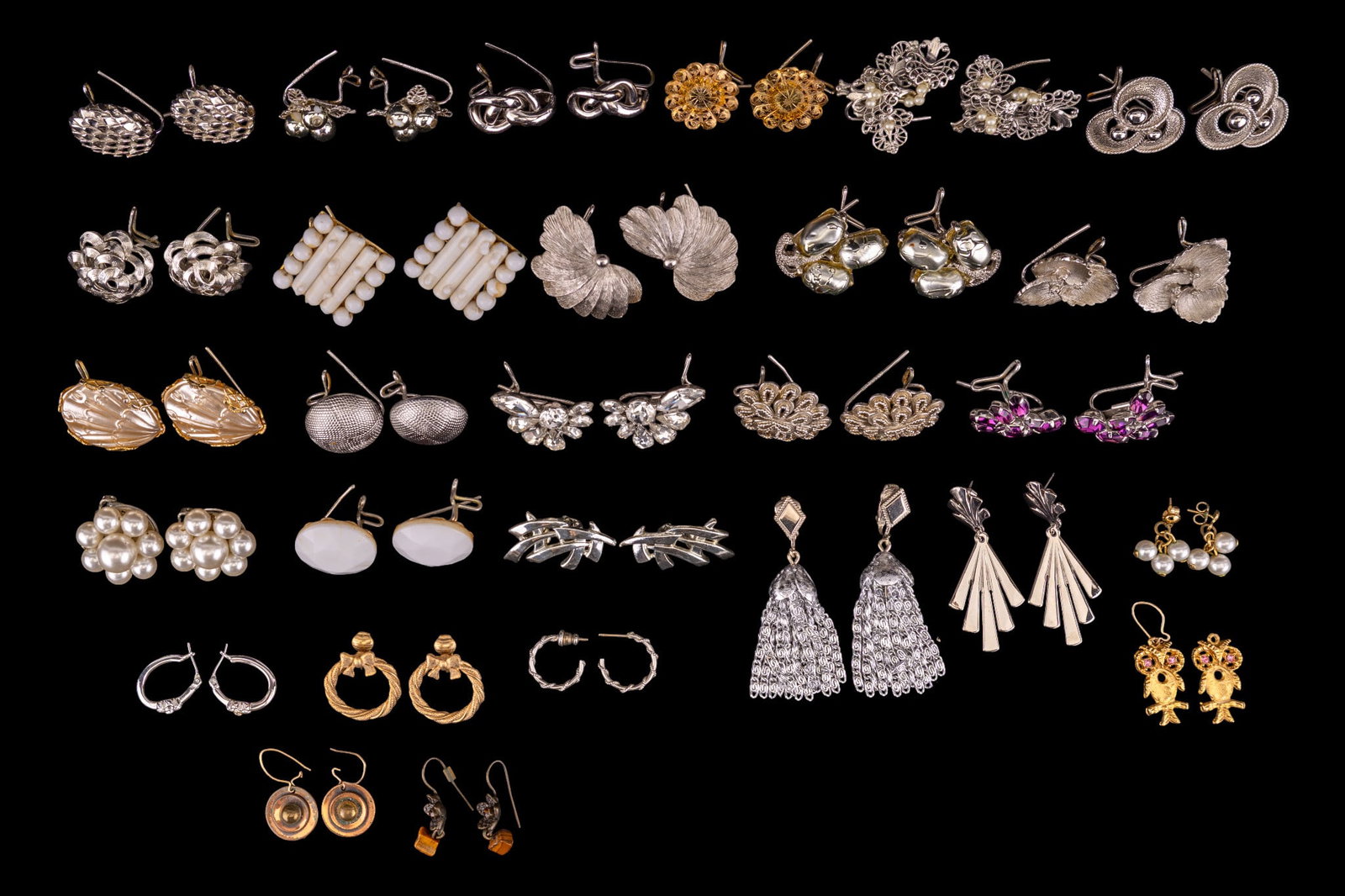 Vintage Designer Costume Earrings: Collection of (17) pairs of vintage designer costume earrings featuring brands such as Sarah Coventry, Coro, and Avon, and some in the Wingback design.