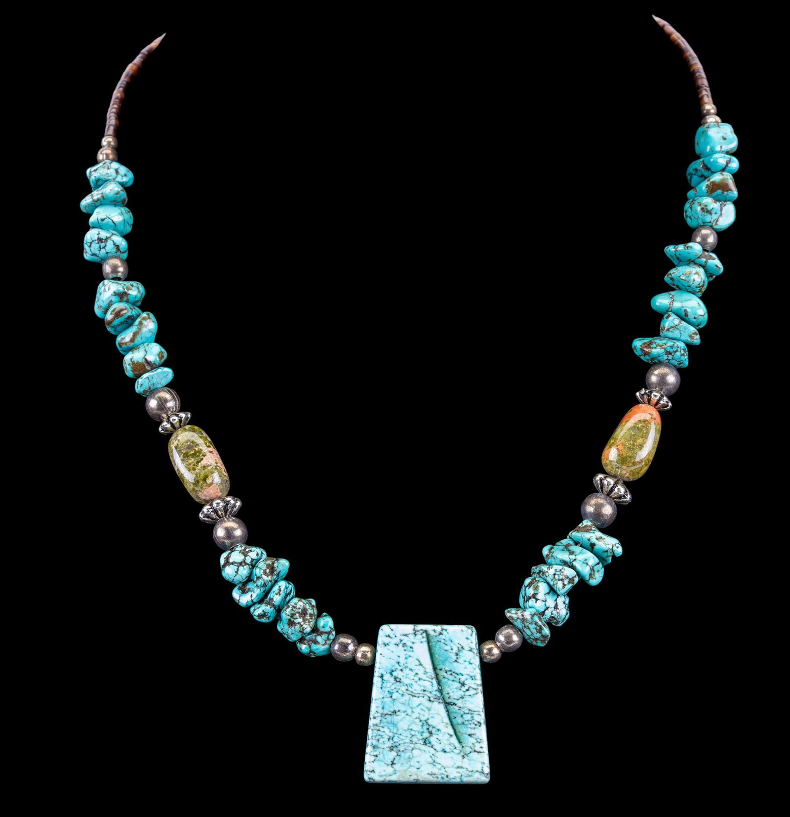 Howlite, Unakite, and Sterling Necklace: A necklace featuring howlite rough tumbled beads, unakite beads, heishi shell beads, sterling beads, and sterling closure. Measures approx. 20" L.