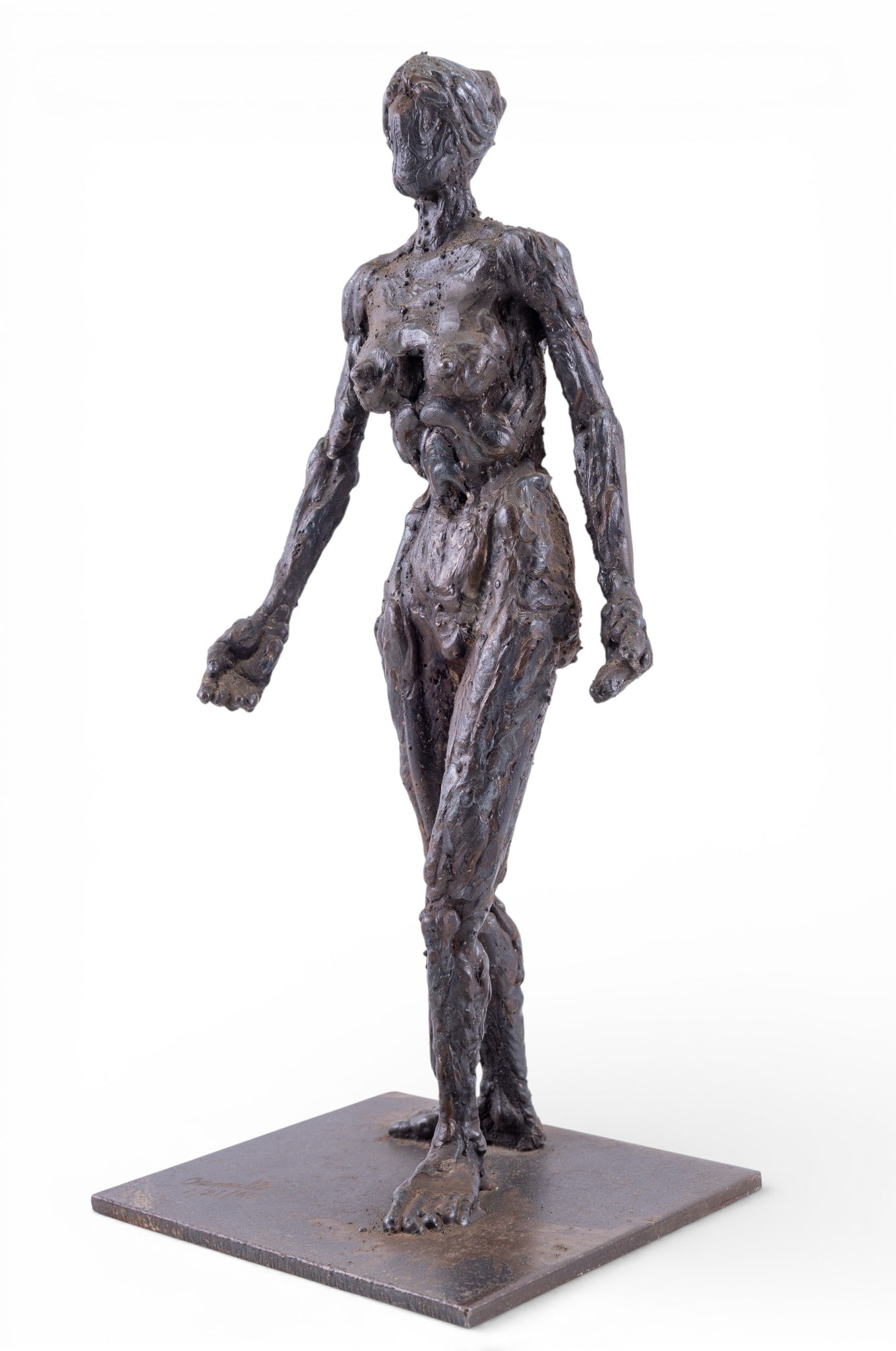 Cast Iron Figural Sculpture, Camillo: Cast iron figural sculpture depicting an elongated nude human form in a modernist expressive style, mounted on a square base. Base is signed Camillo and dated 1/21/65. Measures approx. 15.5" H.