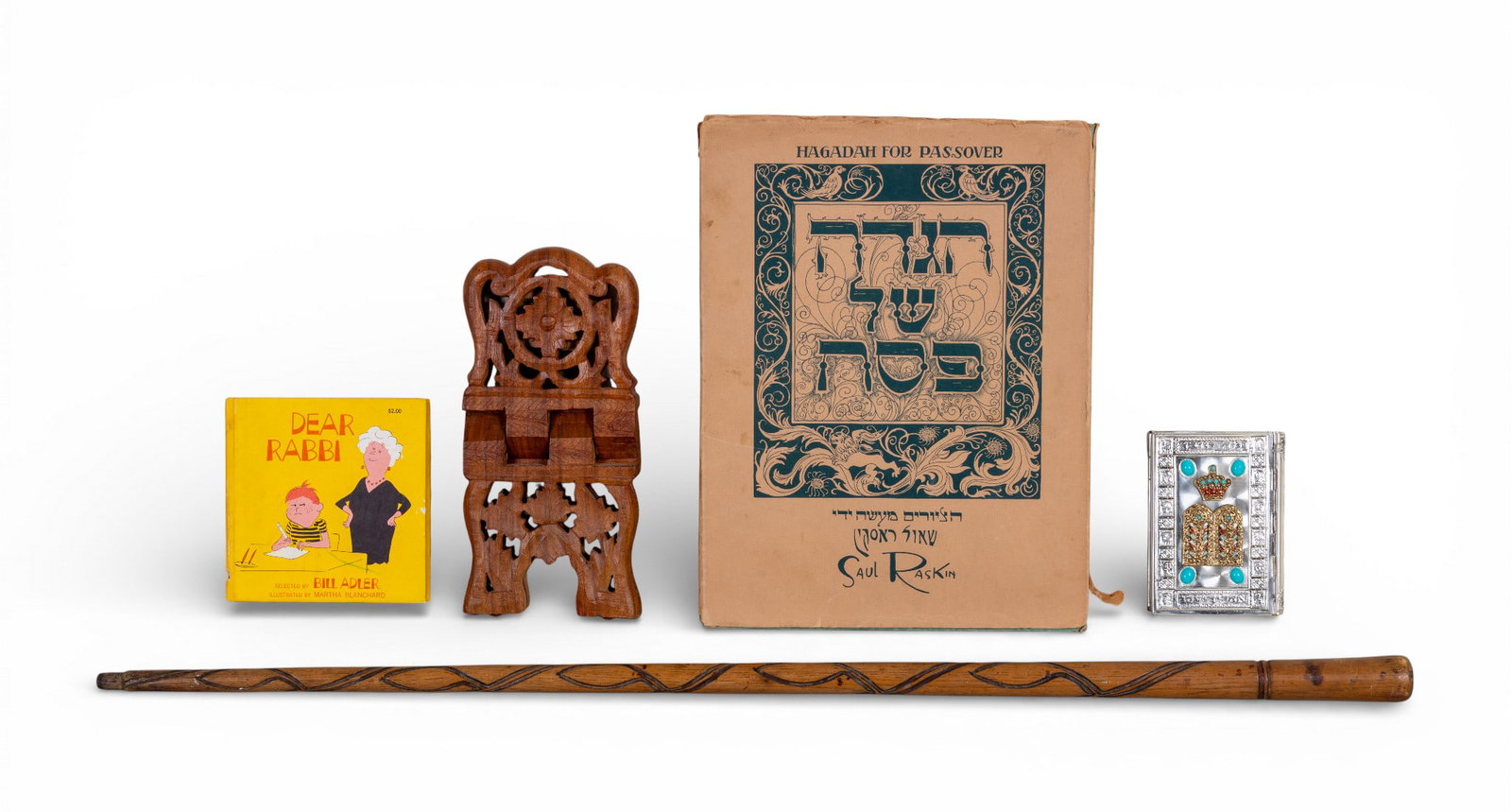 Judaic Books, Walking Stick, and More: A vintage silver toned Siddur Avodat book with fine enamel inlay, 'Dear Rabbi' by Bill Adler, c. 1968, 'Hagadah for Passover' by Saul Raskin, c. 1941, a vintage carved wood walking stick, approx. 34"