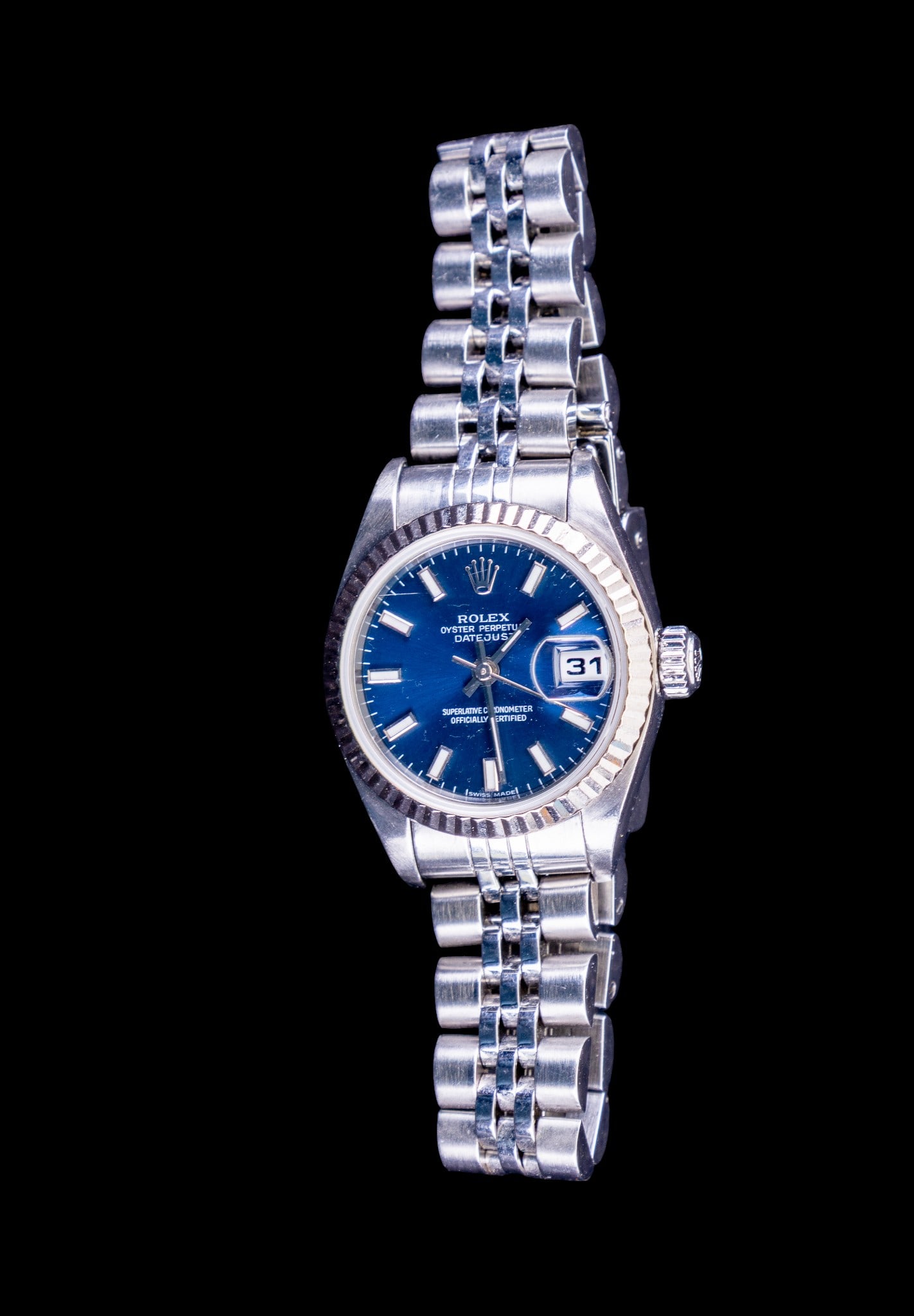 Rolex Ladies Oyster Perpetual Dayjust Wrist Watch: Ladies Rolex Oyster Perpetual Dayjust Y-series wrist watch including original box, case, paperwork, and spare links, featuring a Blue Index dial, model #79174, serial #Y131770. In working condition.
