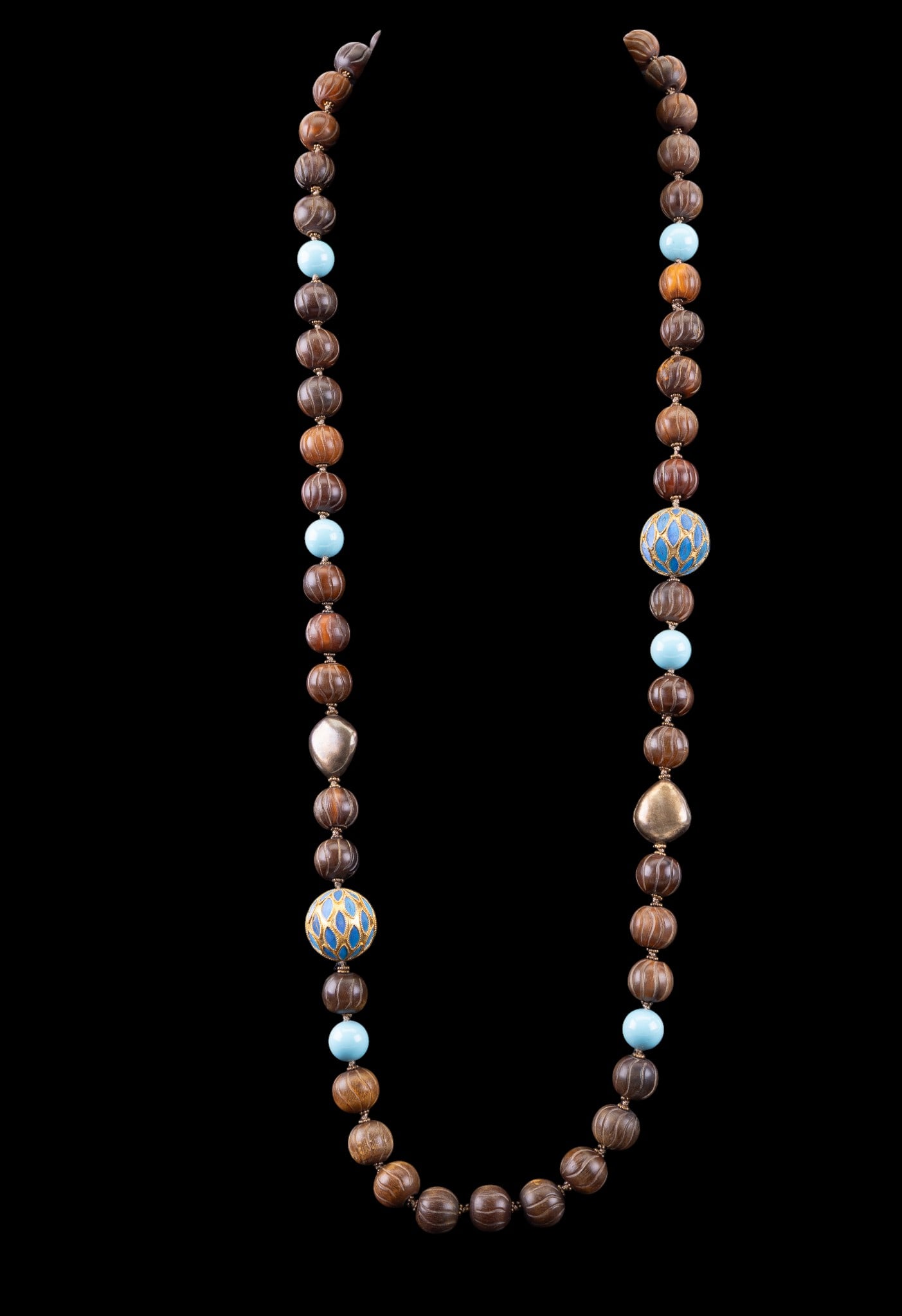 Chinese Wood & Kingfisher Feather Inlay Necklace: A fine vintage Chinese necklace featuring gold tone beads and closure, carved wood beads, acrylic beads, and gold tone oversized station beads featuring inlay consisting of Kingfisher feathers. Measur