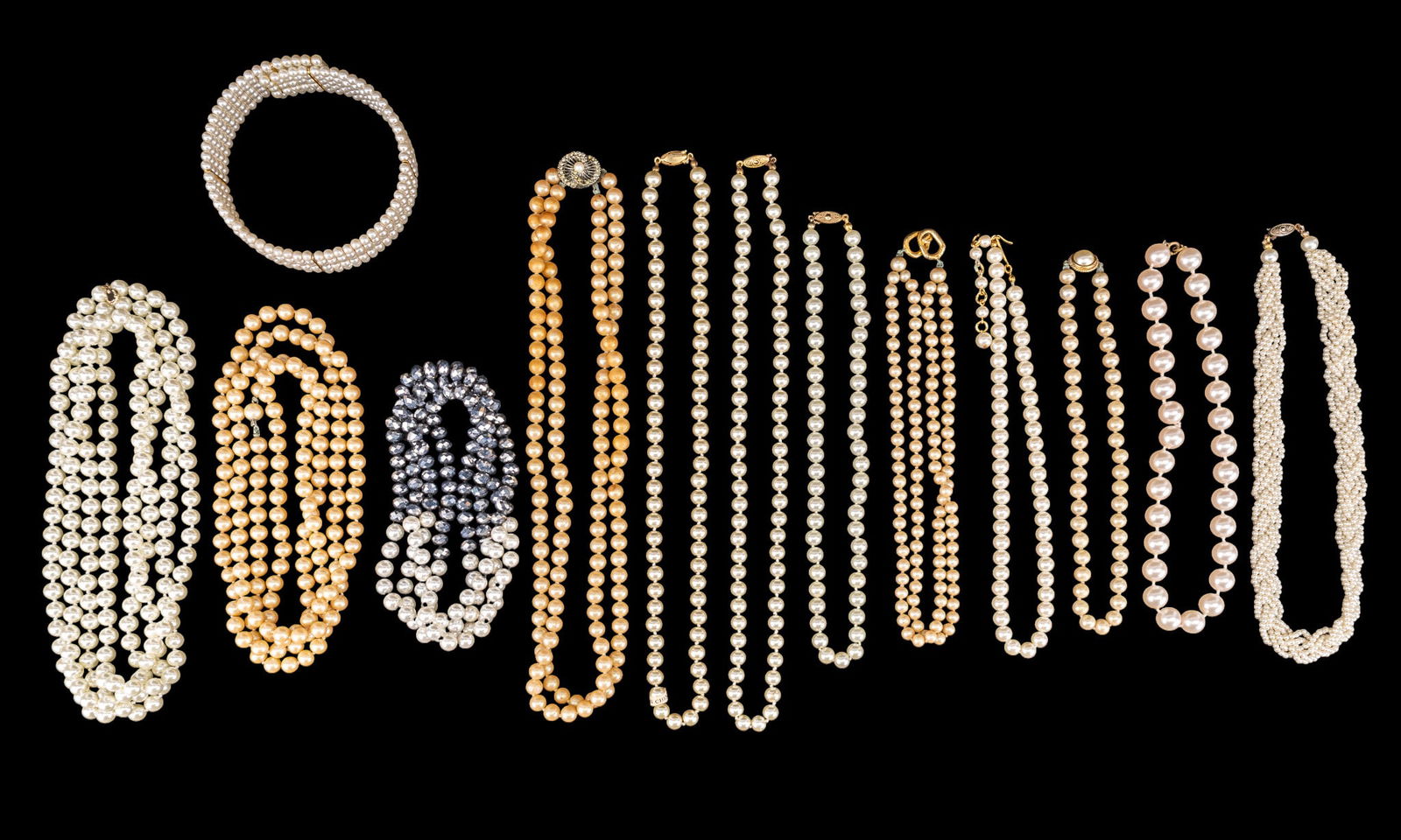 Costume Pearl Jewelry: A large collection of vintage and contemporary costume pearl necklaces and bracelets.