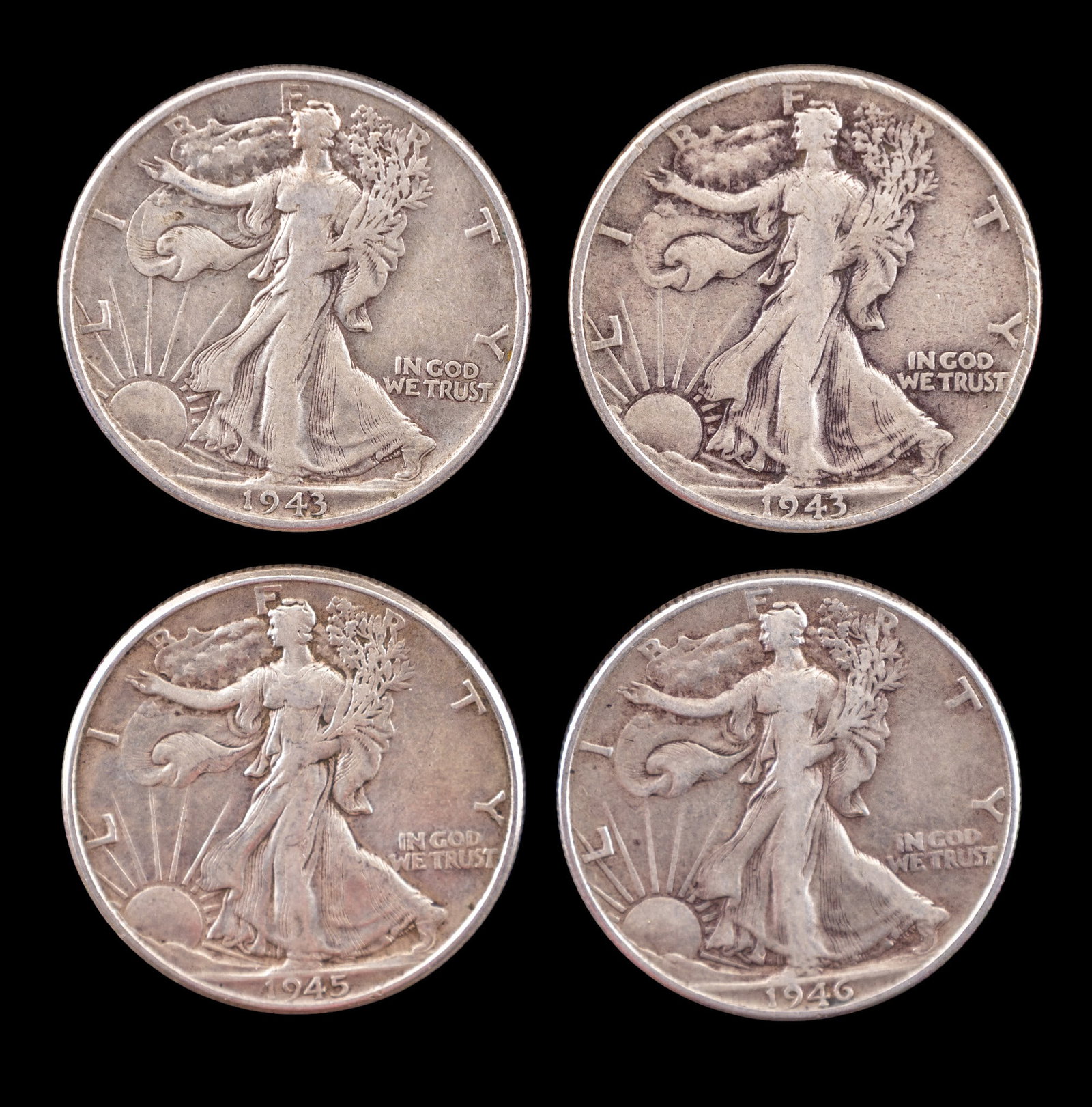 4 Walking Liberty Silver Half Dollars c1940s: Four Walking Liberty Half Dollars dated 1943, 1945, and 1946. Struck in 90% silver, these coins feature Adolph A. Weinman's iconic Liberty design on the obverse and a heraldic eagle on the reverse. Co