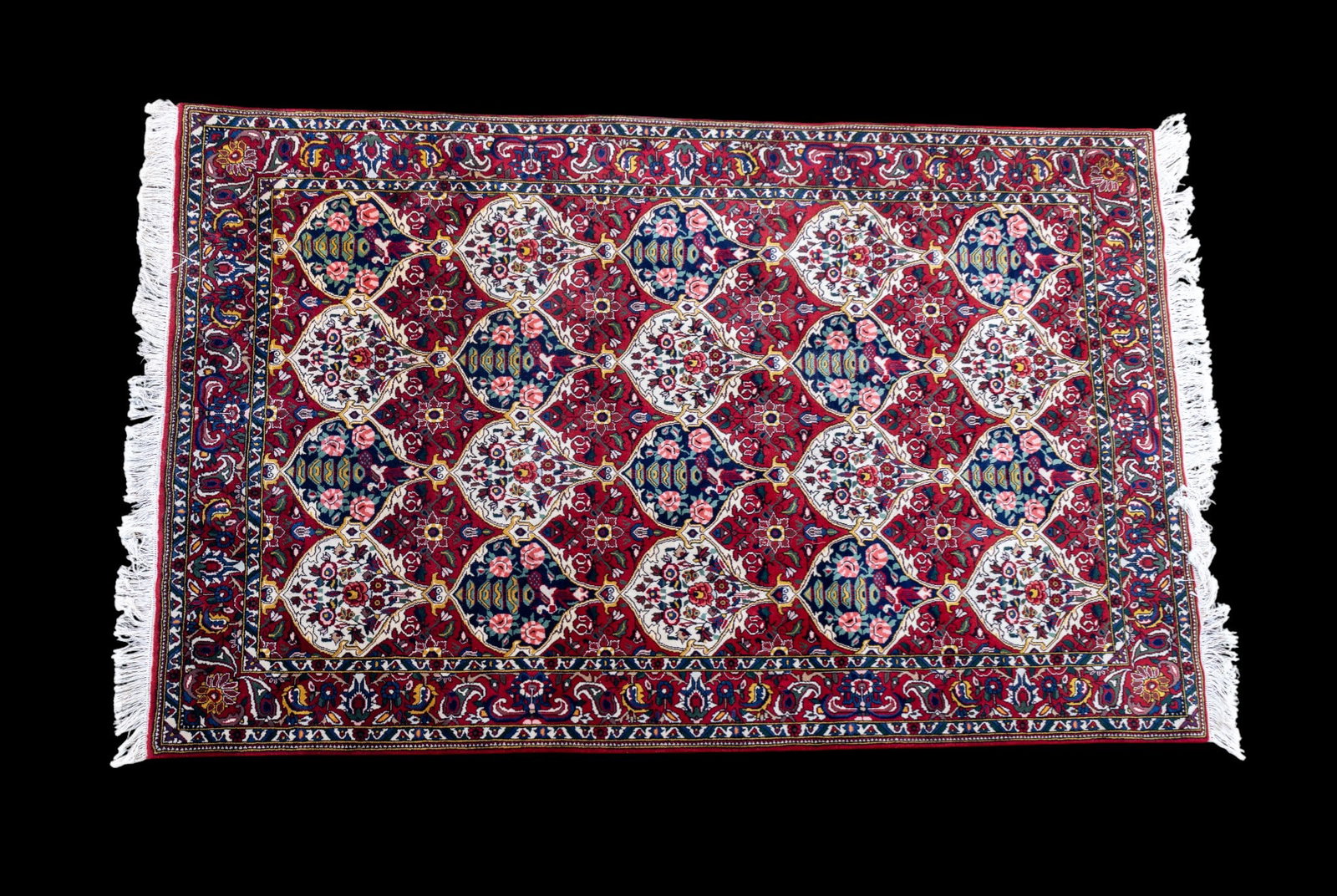 Hand-Knotted Wool Tabriz: Hand-knotted wool tabriz with green, cream, red, and pink tones. Measures approx. 5'8" x 8'2".