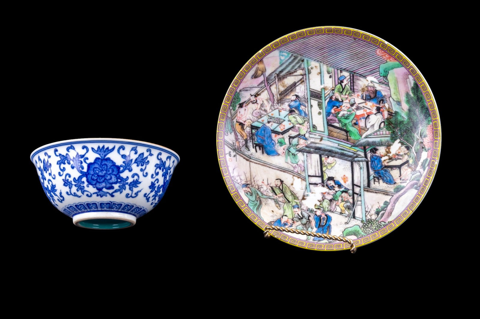 Chinese Porcelain Bowl, Famille Rose Plate: Group of 2 Chinese porcelain items including a Famille Rose porcelain plate, decorated with a detailed figural interior scene depicting scholars and attendants in a courtyard setting, bordered by a ye
