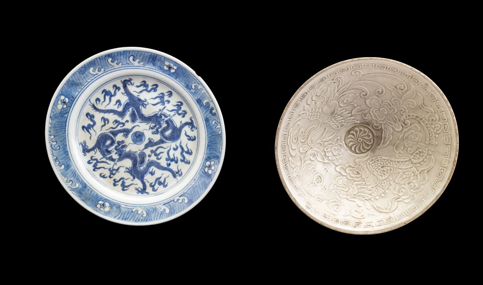 Chinese Song and Blue & White Porcelain: An antique Chinese Song dynasty white glazed porcelain bowl featuring a dragon and phoenix relief design on the interior and an incised mark on the bottom, measures approx. 8" diam x 2.5" H, and a Chi