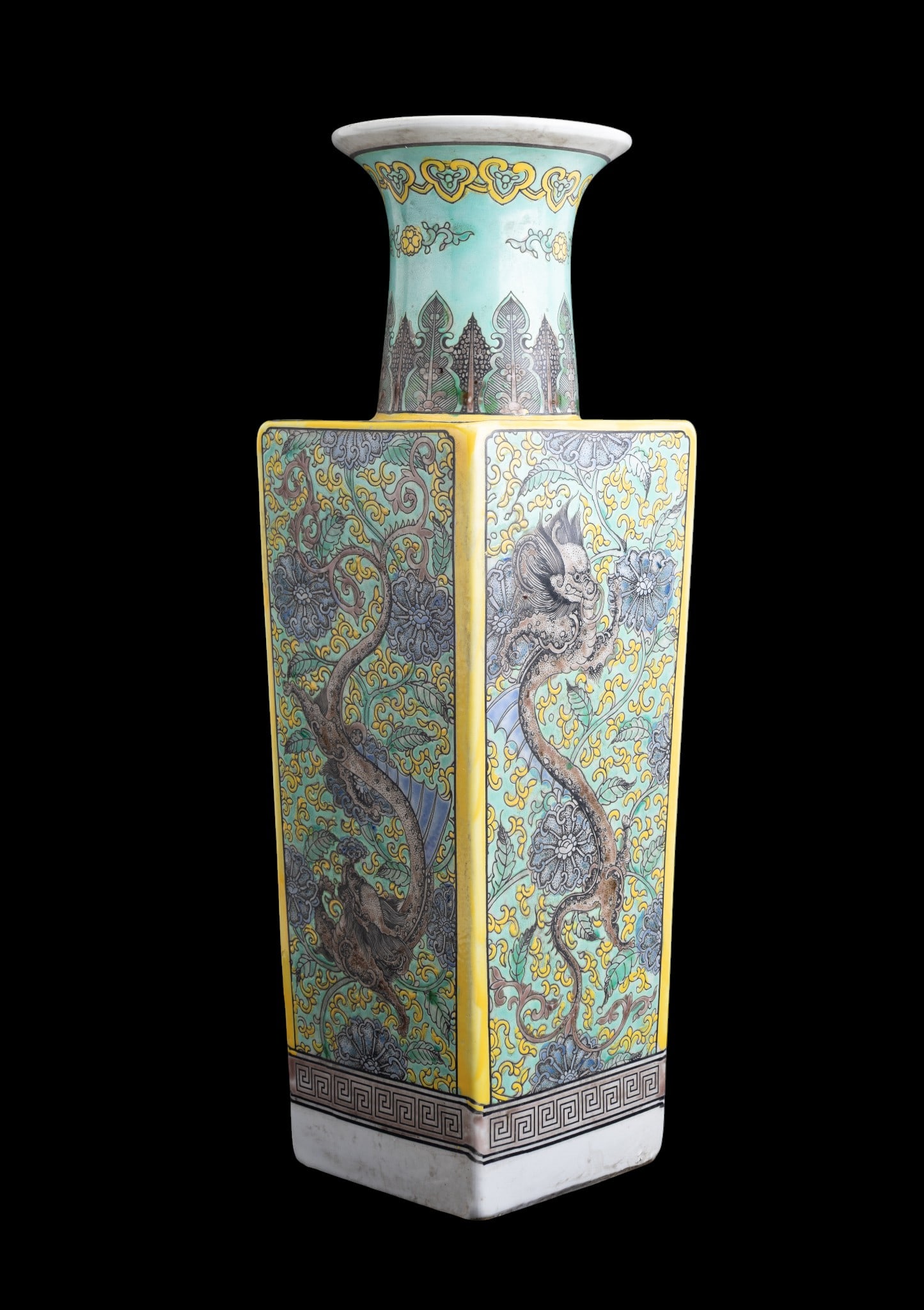 Chinese Porcelain Square-Section Vase: Chinese porcelain vase of square section with flared cylindrical neck, decorated in green, yellow, and turquoise enamels. Each side features a dragon amid scrolling foliate motifs. Underside bears a 6