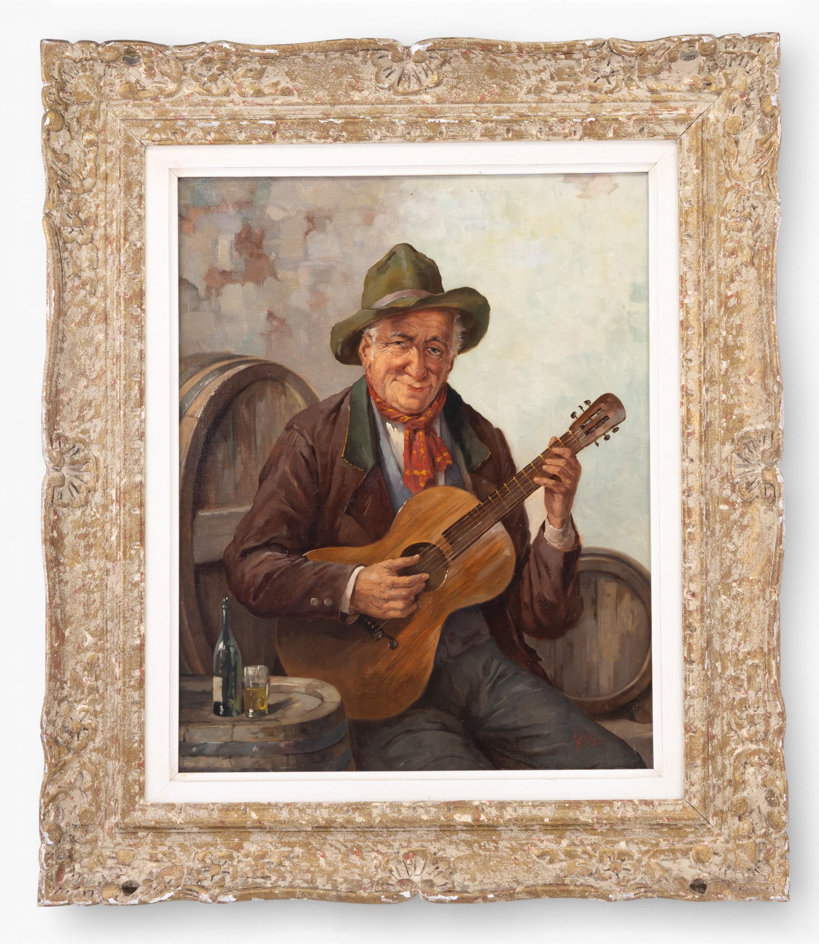 Framed Oil Painting of Guitarist, Signed: Oil on board painting depicting an eldery man seated with guitar, shown before wine barrels and a small bottle glass on a cask. Signed lower right (illegible). Possibly attributed to Hans Kerber (Aust