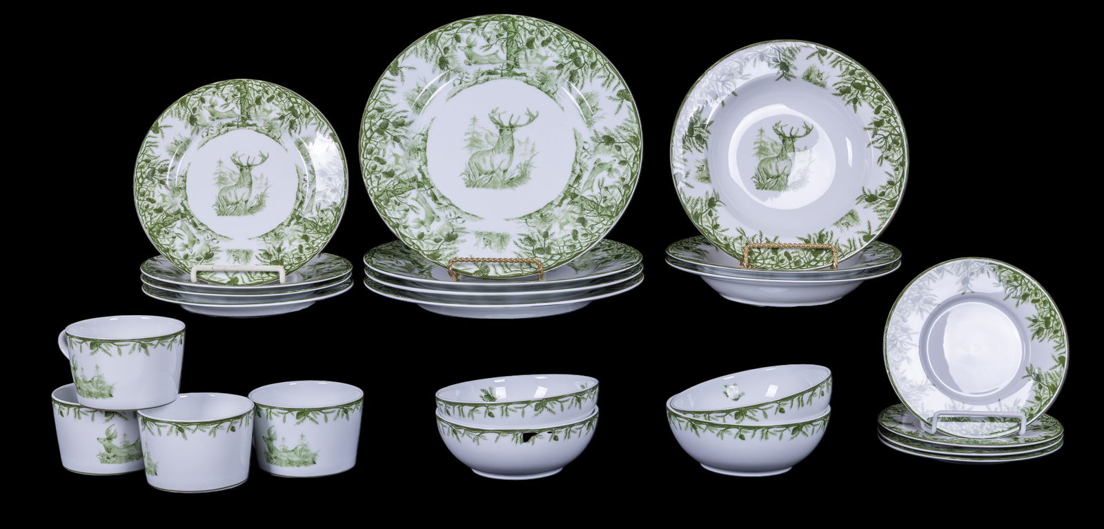 C.E. Corey "Forest" Porcelain Dinner Service: Set of porcelain tableware in the "Forest" pattern by C.E. Corey, Portugal. Decorated in green with woodland scenes featuring a buck, rabbits, and foliage. Includes a service consisting of (3) soup bo