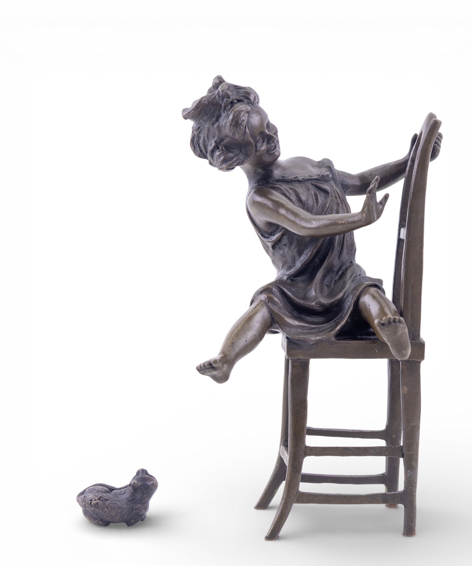 Signed Bronze Girl With Cat: Bronze figural sculpture depicting a young girl seated on a chair, with a small cat at her feet. Signed on the underside of chair. Measures approx. 8.5" H.