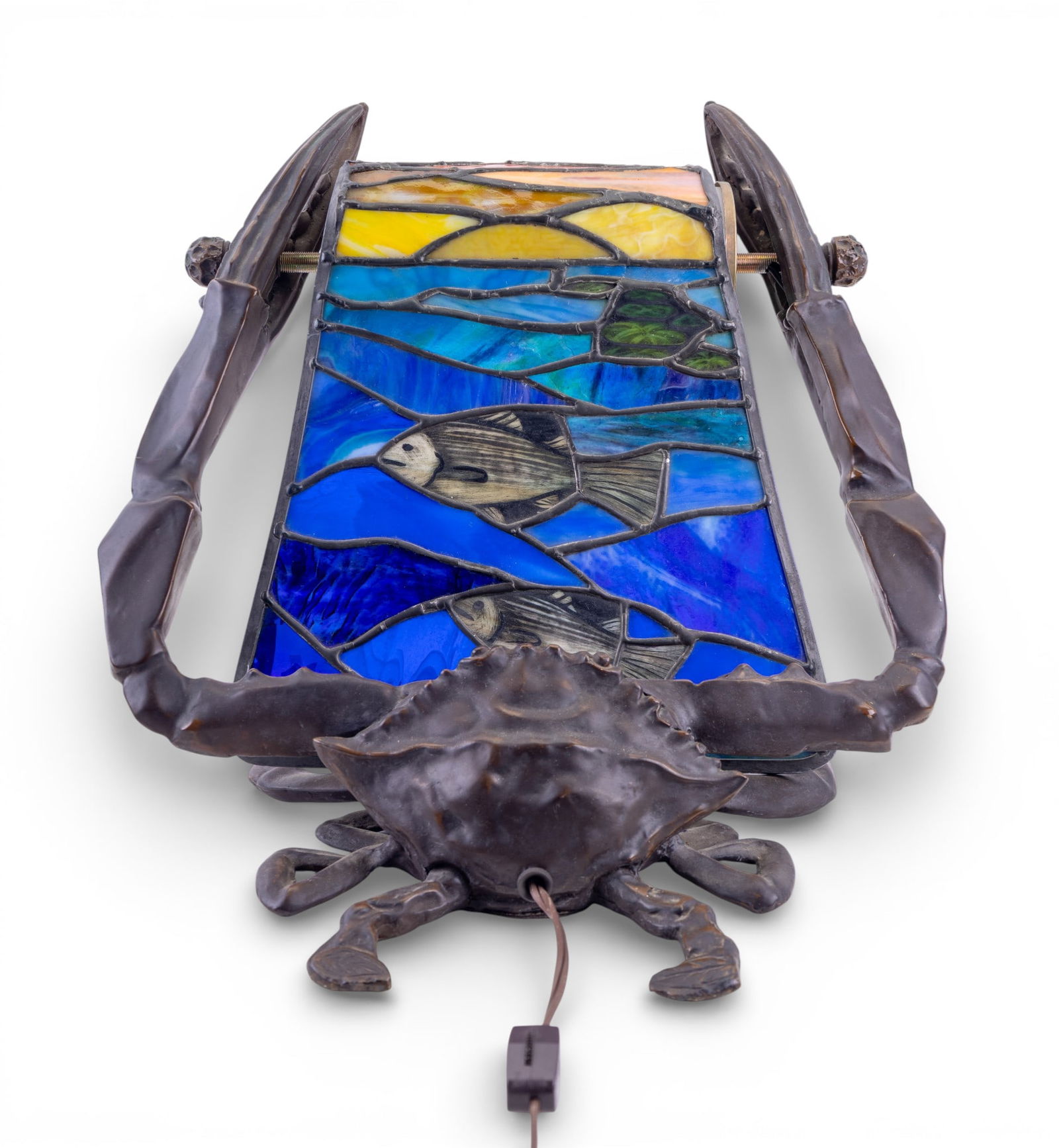 Bronze Crab Figural Lamp w/ Slag Glass Shade: Figural bronze lamp modeled as a crab with articulated legs and raised claws supporting a cylindrical leaded glass shade. Shade features fish and multicolor decoration. Measures approx. 11.5" H x 13"