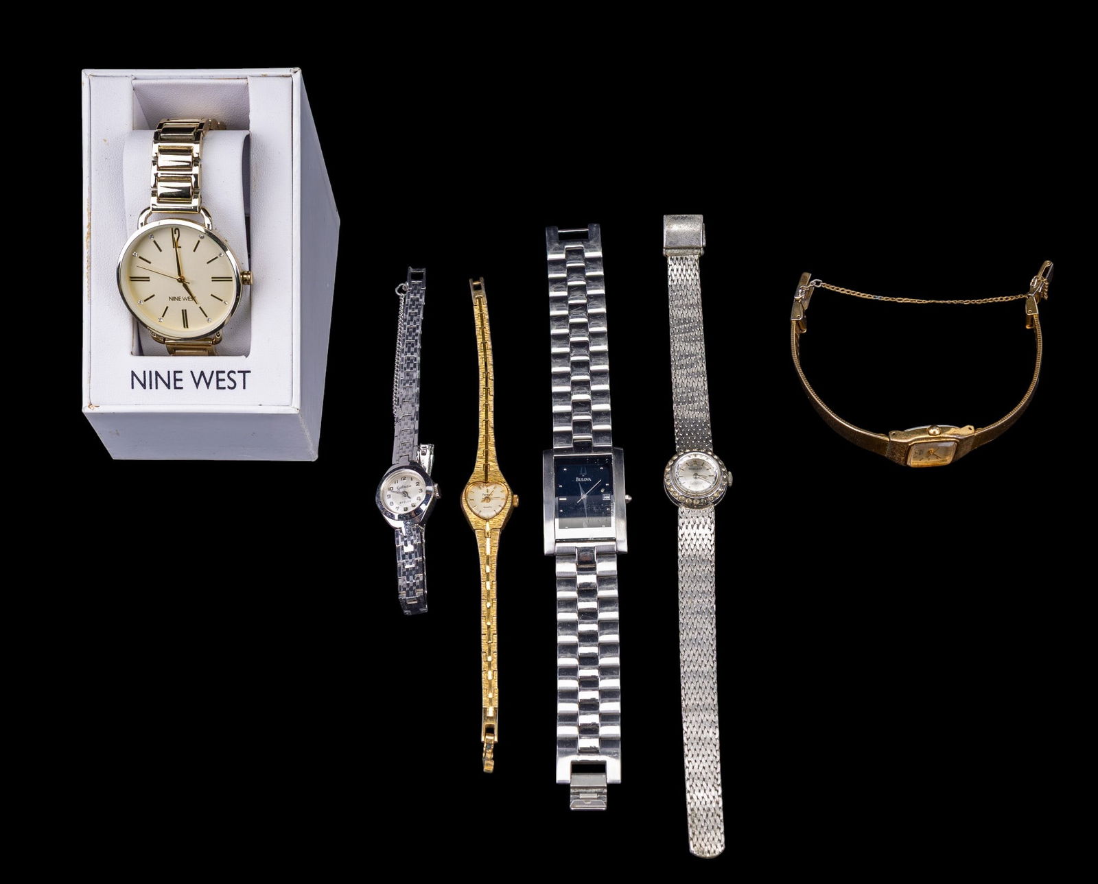 6 Ladies Wristwatches: Six wristwatches from various brands including Bulova, Nine West, Nobellux, Seiko, Firmador, and Galaxie by Elgin. Materials vary, with some featuring stainless steel, gold-tone finishes, and jeweled