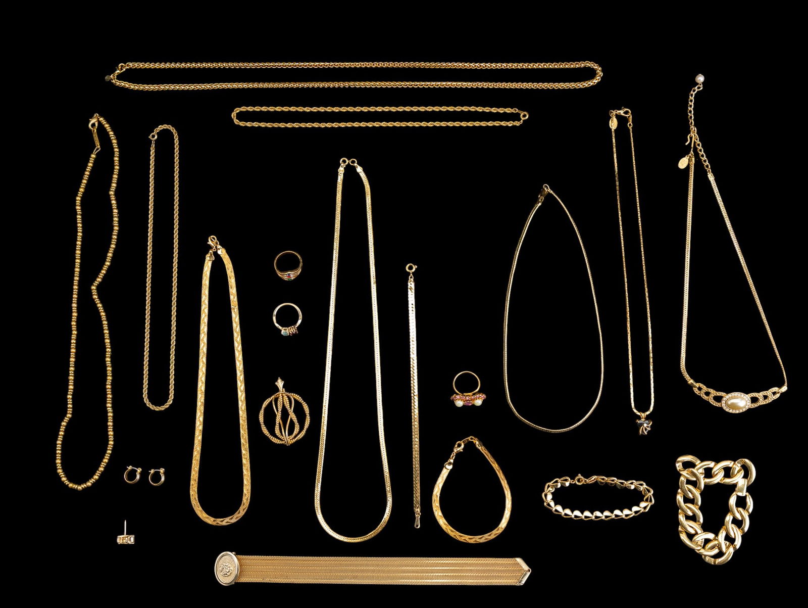 Gold Tone Designer Jewelry Collection: A collection of gold tone designer jewelry including brands such as Napier, Premier Designs, Sarah Coventry Princess House, Lois Jean, and others. Rings sized at 7.5, longest chain measures approx. 11