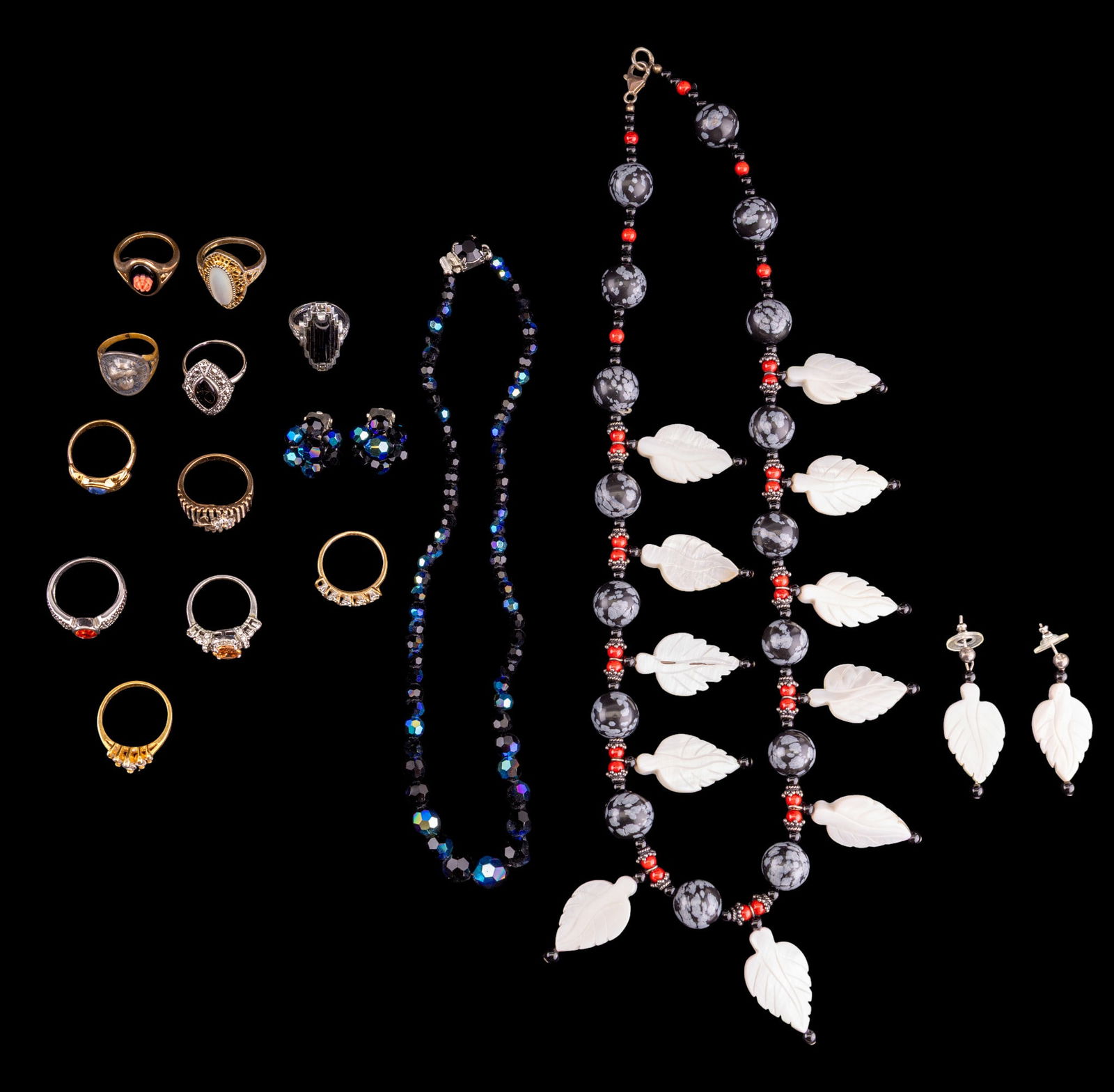 Vintage Rings, Mother of Pearl and Stone, and More: A collection of 11 costume rings featuring an Art Nouveau Barber Dime coin ring with Lady Liberty relief, navette mother of pearl ring, an 18K HGE ring with five clear rhinestones, a graduated facet c