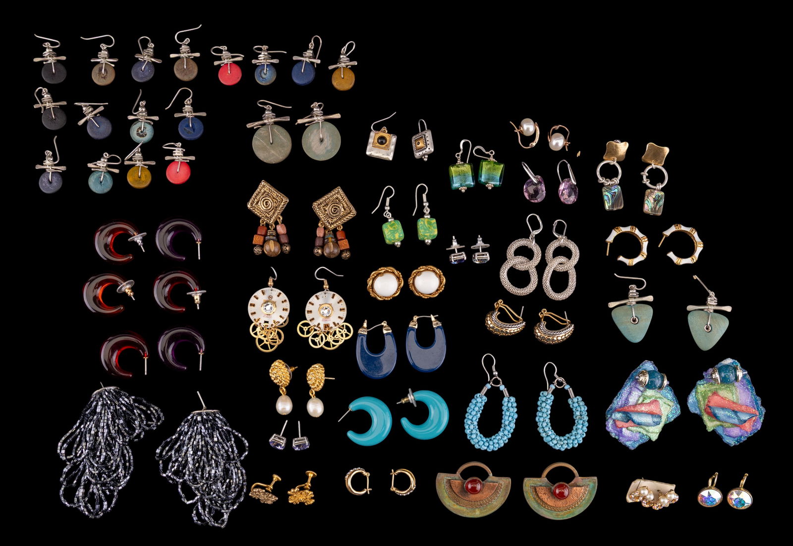 Costume Earrings (36 prs): A collection of 36 pairs of costume earrings featuring pierced styles, enamel, blown glass, rhinestone, abalone, a pair of iridescent crystal gold tone earrings by Swarovski, and more.