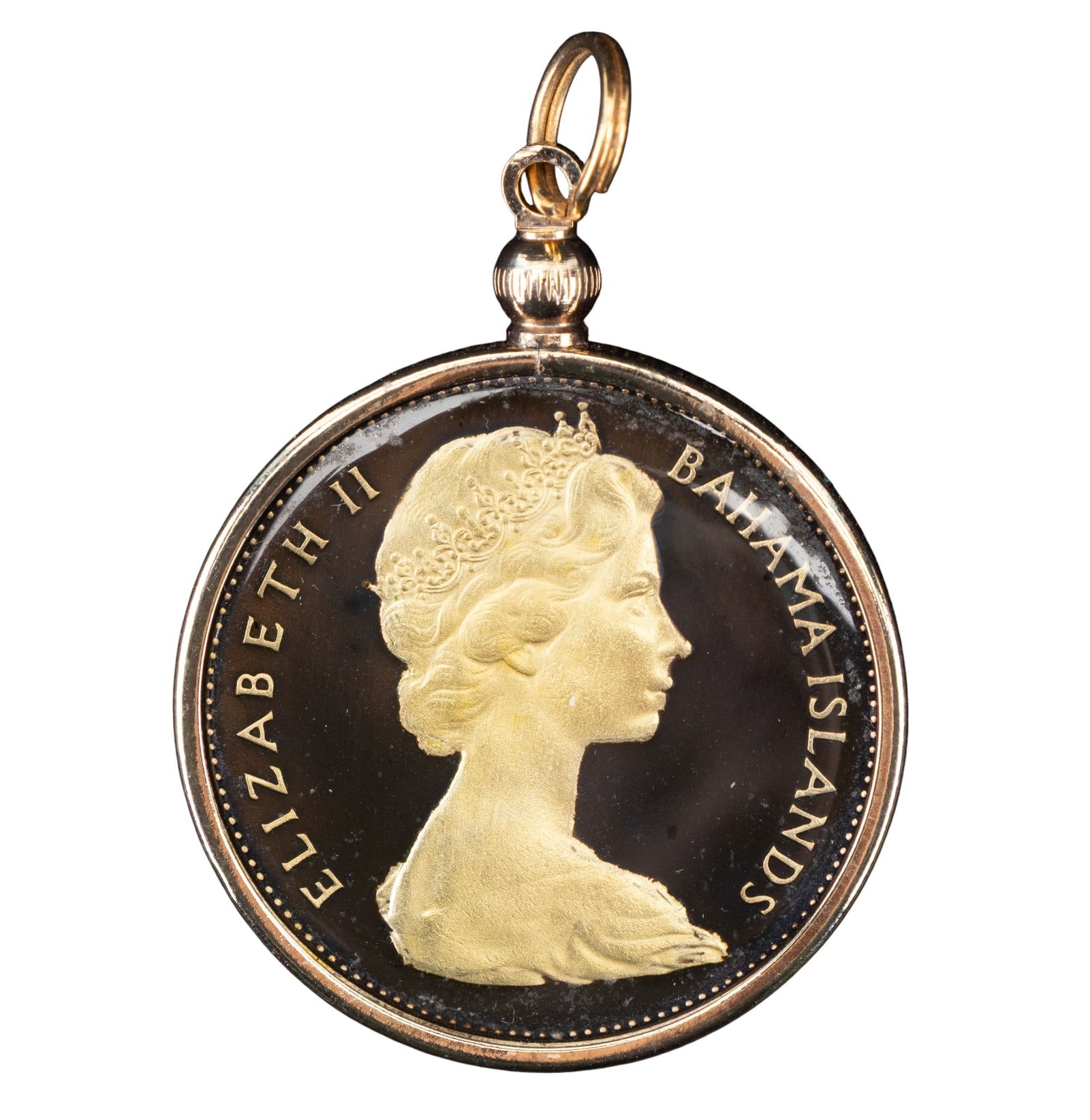 Hand Painted Bahamas Coin Pendant: A hand painted pendant made from a genuine 1966 Bahamas one-dollar silver coin featuring a conch shell design with Queen Elizabeth II on the reverse.